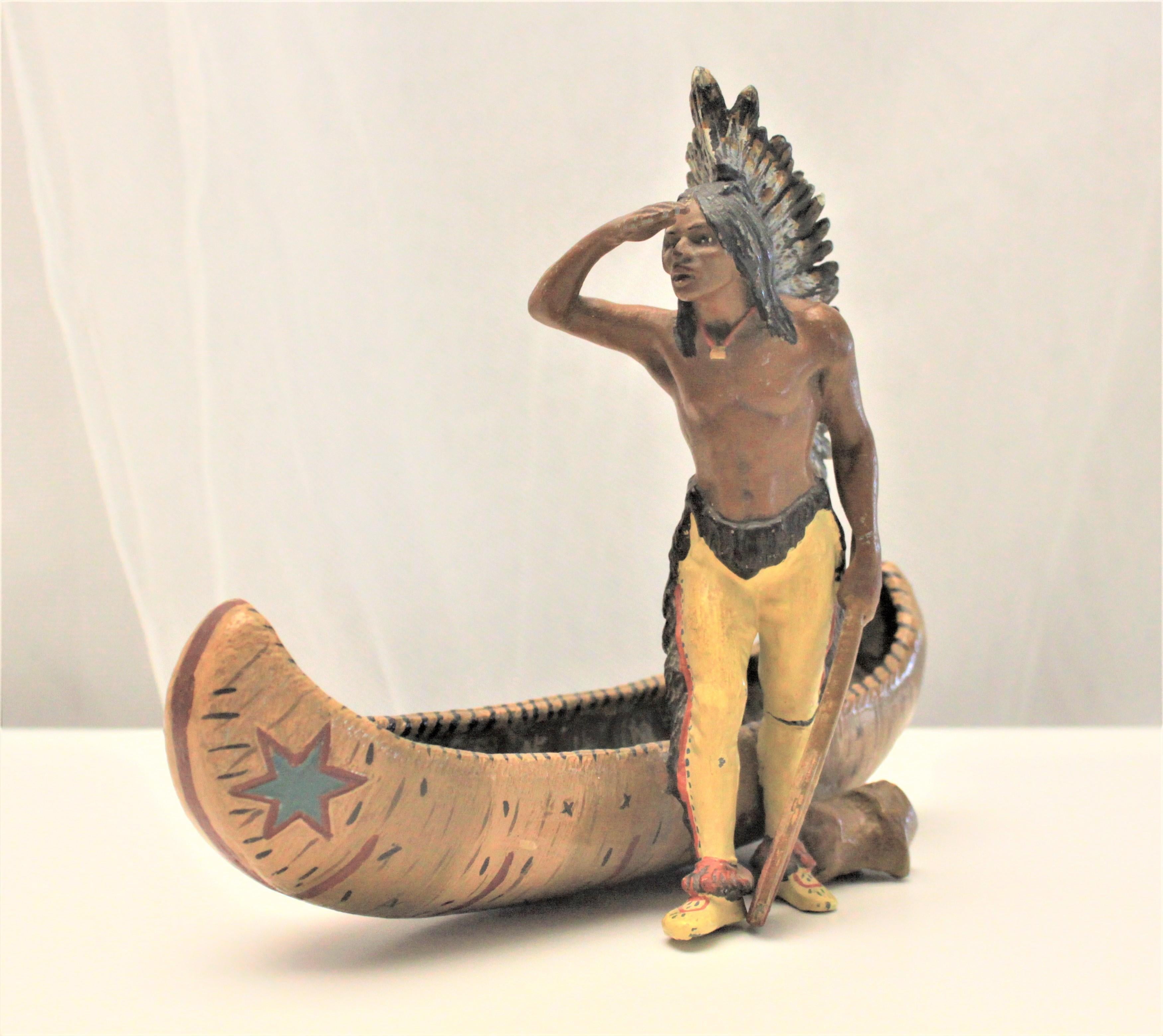 Austrian Antique Cast Metal and Cold Painted Native Indian and Canoe Figurine