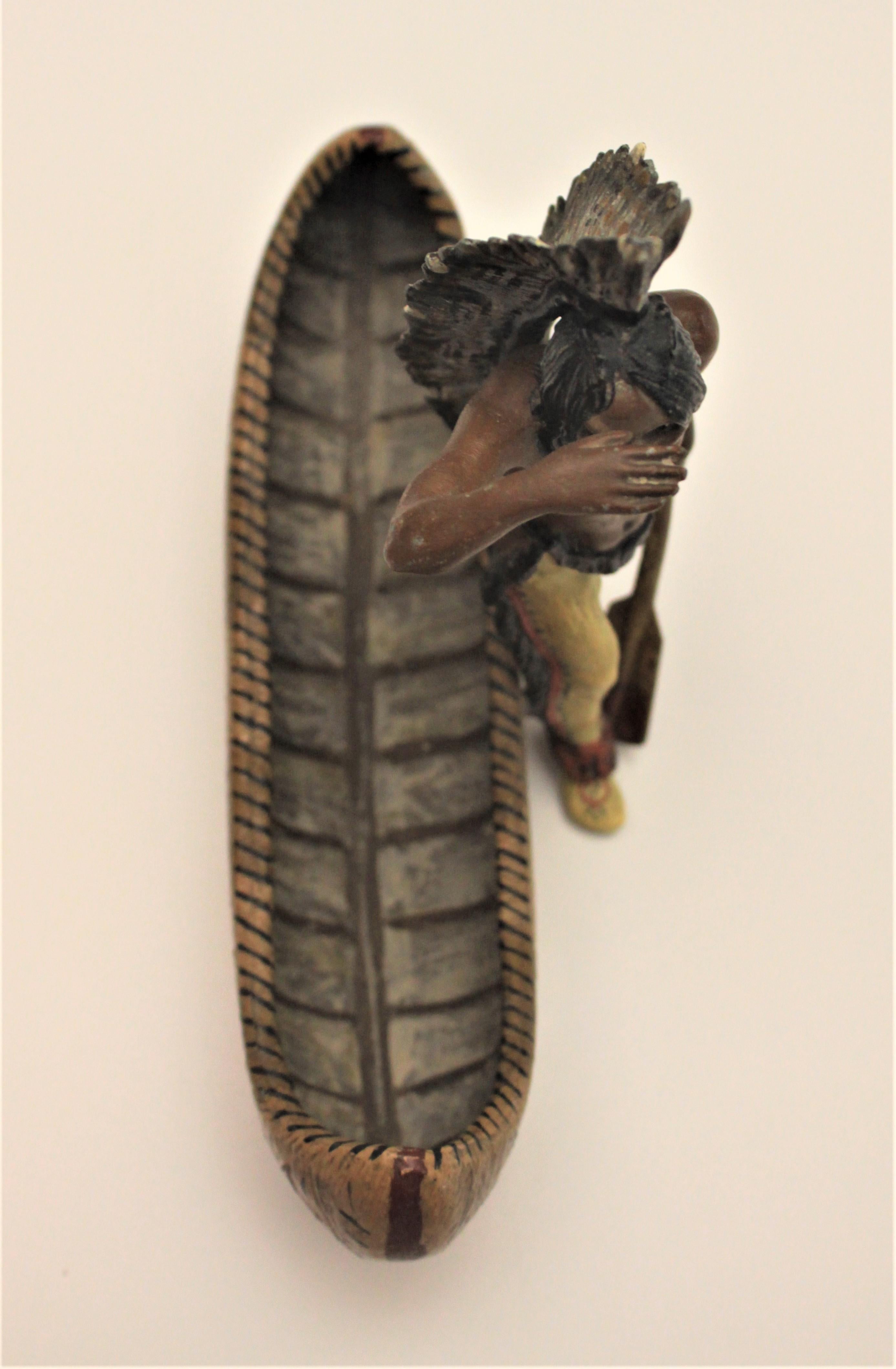 Antique Cast Metal and Cold Painted Native Indian and Canoe Figurine In Fair Condition In Hamilton, Ontario
