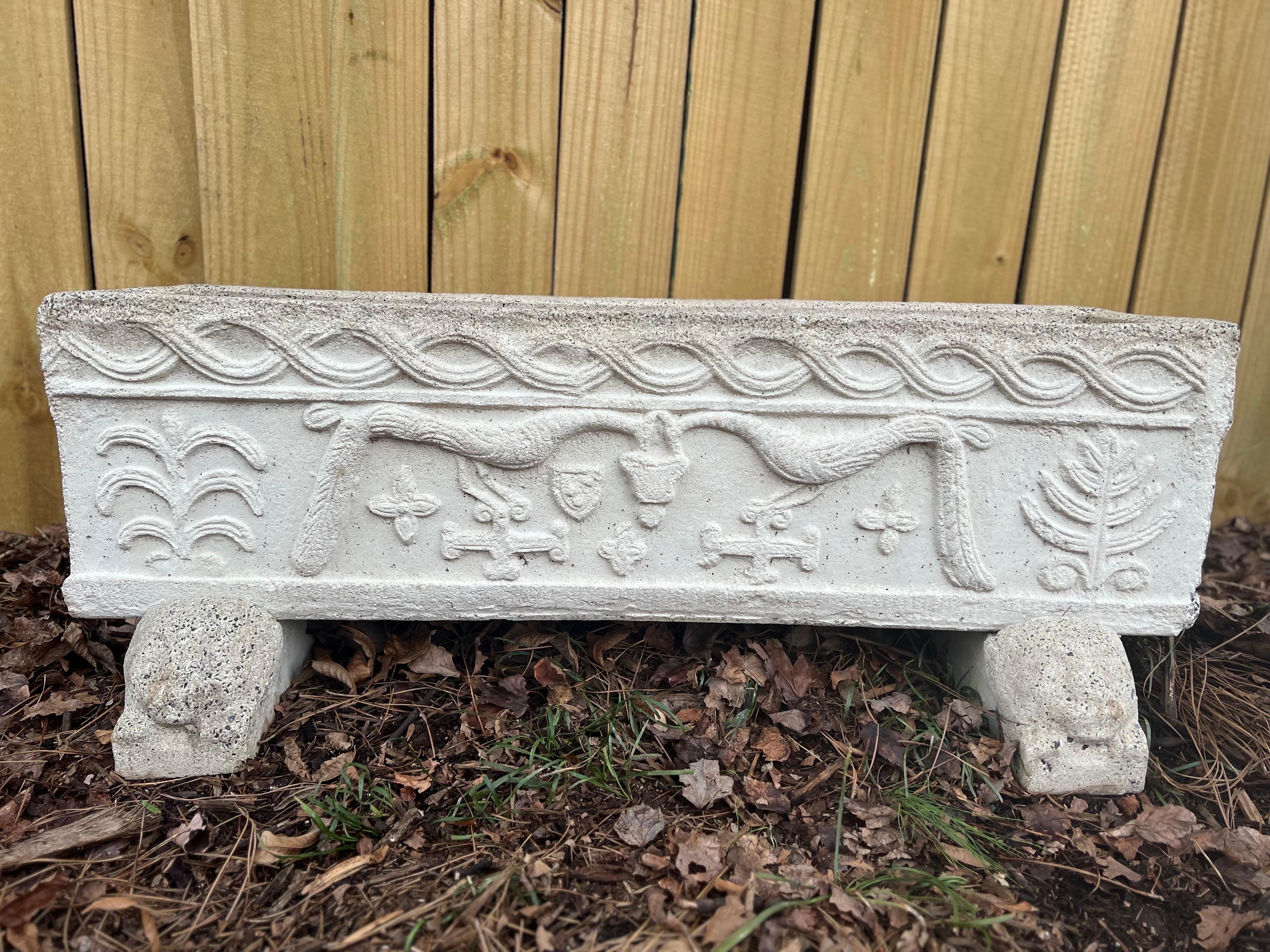 Antique Cast Stone planter with carving of Peacocks, tree's and symbols.  Rests on two pedestals with lion heads.

Rectangular trough shape with drainage holes for plants.  See images for condition.

