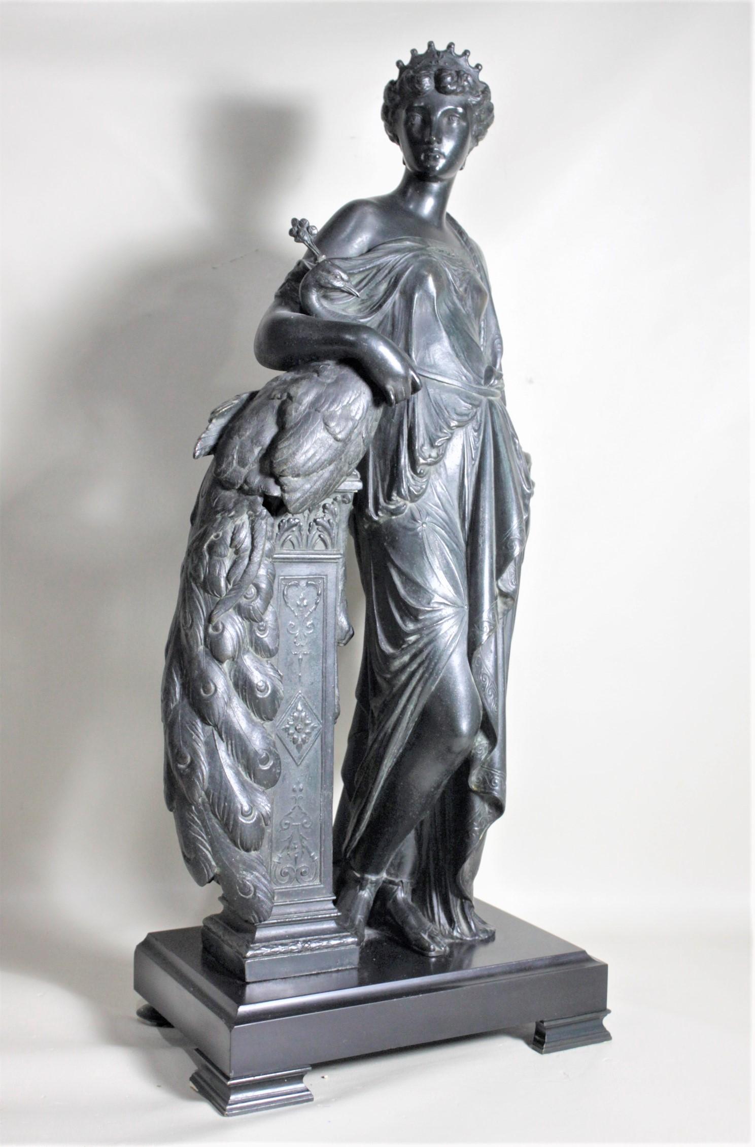 This large and substantial antique cast spelter sculpture is unsigned but presumed to have been made in France in circa 1880 in the neoclassical style. This very detailed cast sculpture depicts a robed neoclassical woman, possibly Hera the Greek