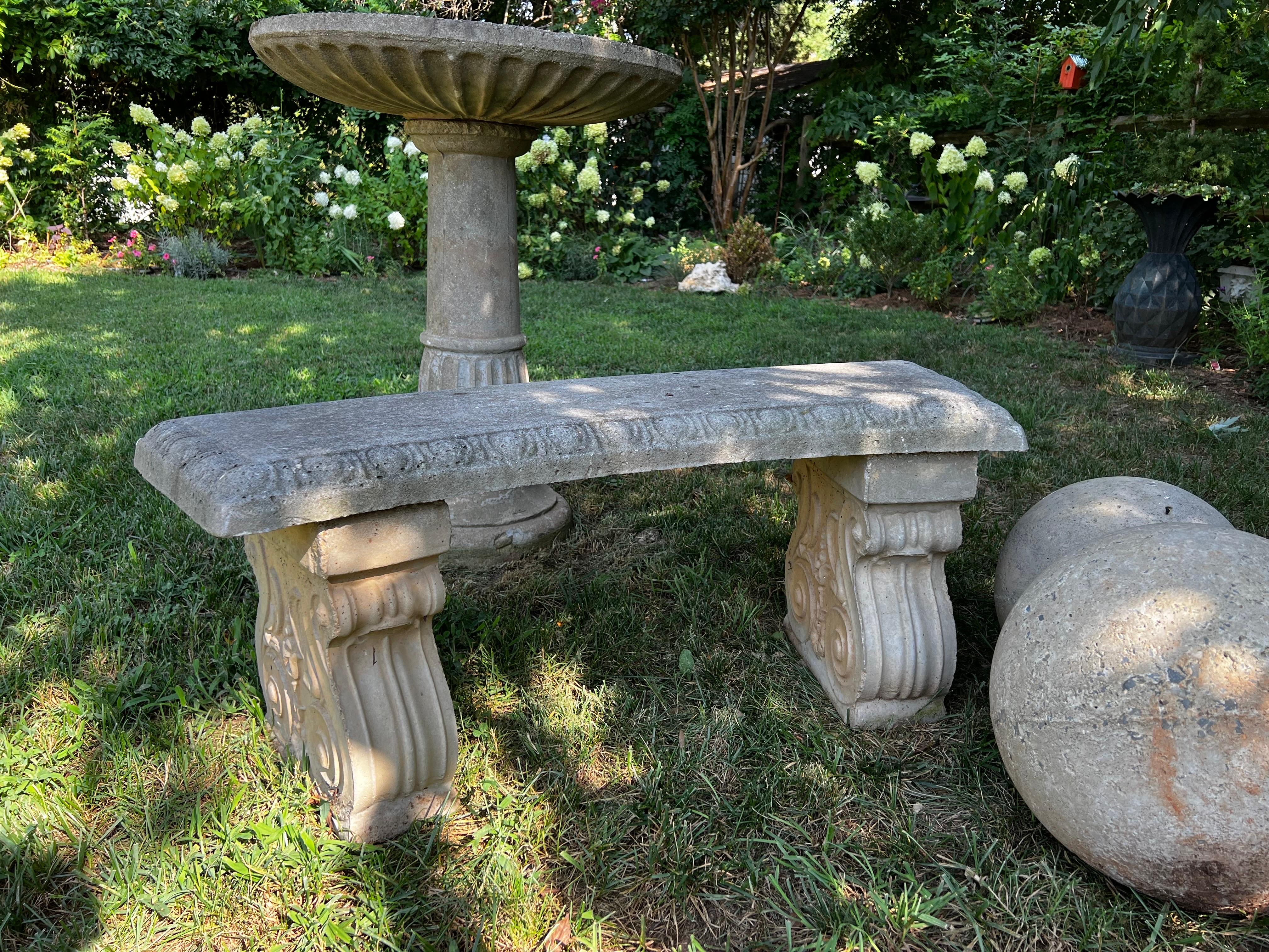 Cast stone garden bench. Slight curve seat sits on two pedestals with carvings.
Beautiful aged patina adding elegance to any garden space or entrance. 

See pictures for details. Measurements in listings.