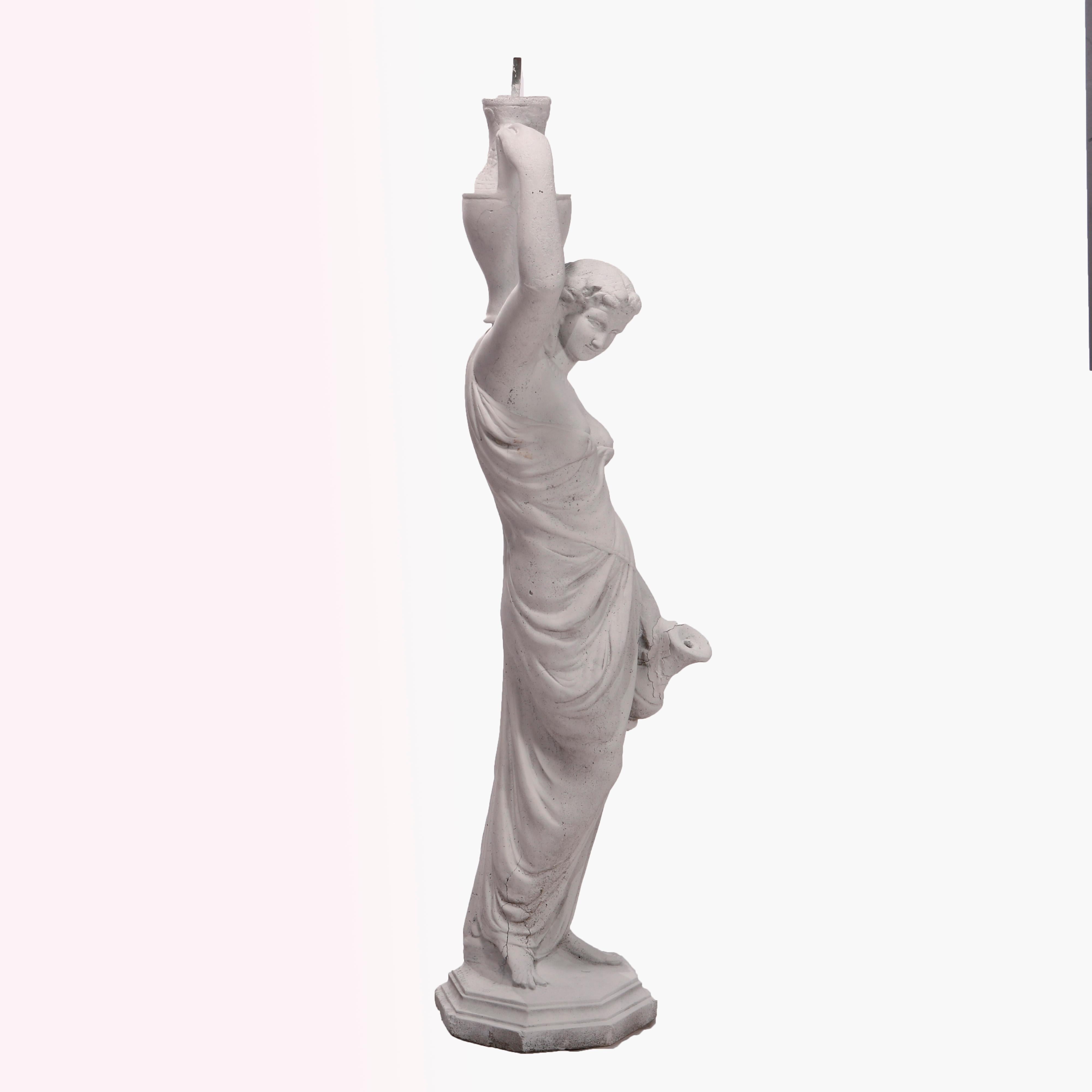 A figural garden fountain offers cast stone classical Greek woman with water vessels, c1920

Measures - 58.5'' H x 17.5'' W x 17.5'' D.