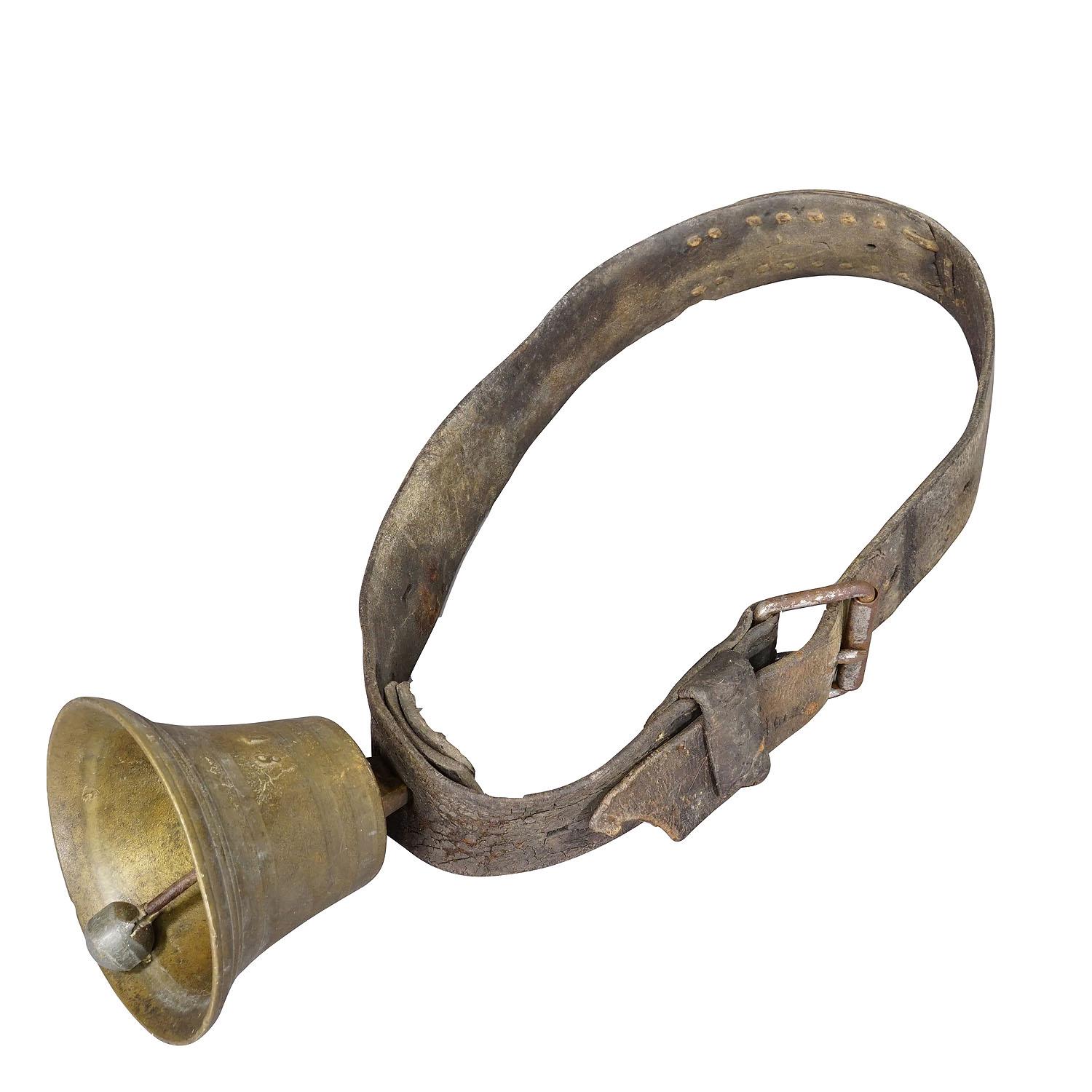 Antique Casted Bronze Cattle Bell Made in Switzerland ca. 1900s

An antique cast bronze cattle bell, made in Switzerland around 1900. The bell comes with its original brown leather strap with buckle. Bells like this are still used today to locate