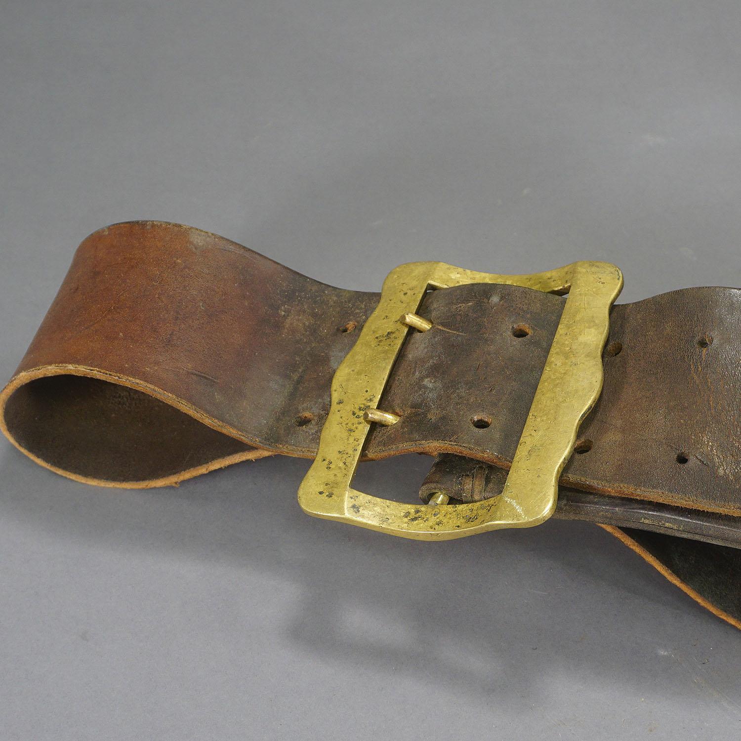 antique cow bell with leather strap