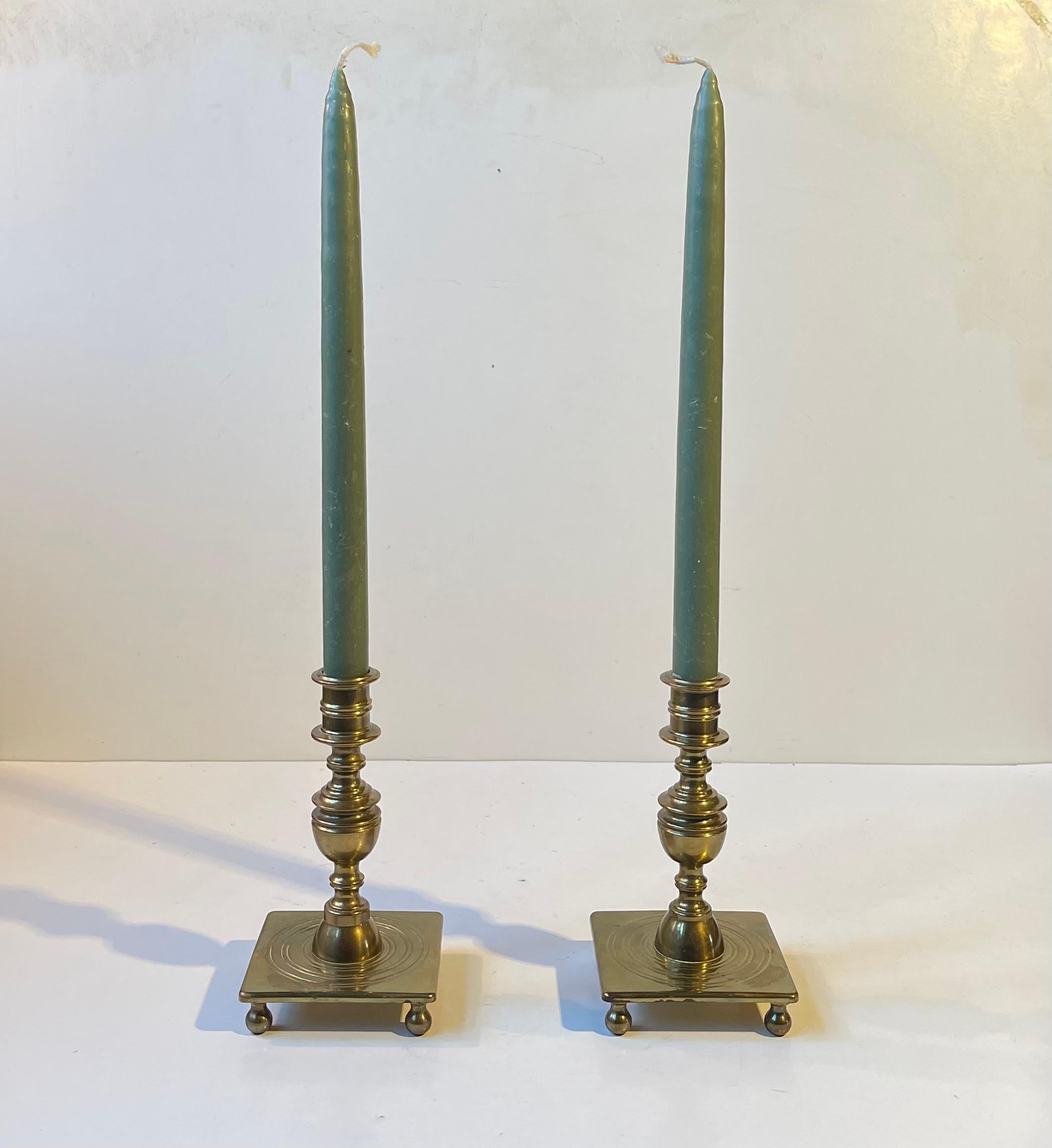 This type of candleholders are called castle or manor candlesticks in Denmark. Originally designed in the late 17th century up into the 18th century. This set dates from circa 1900-1920 and is executed with all the distinct baroque features of a