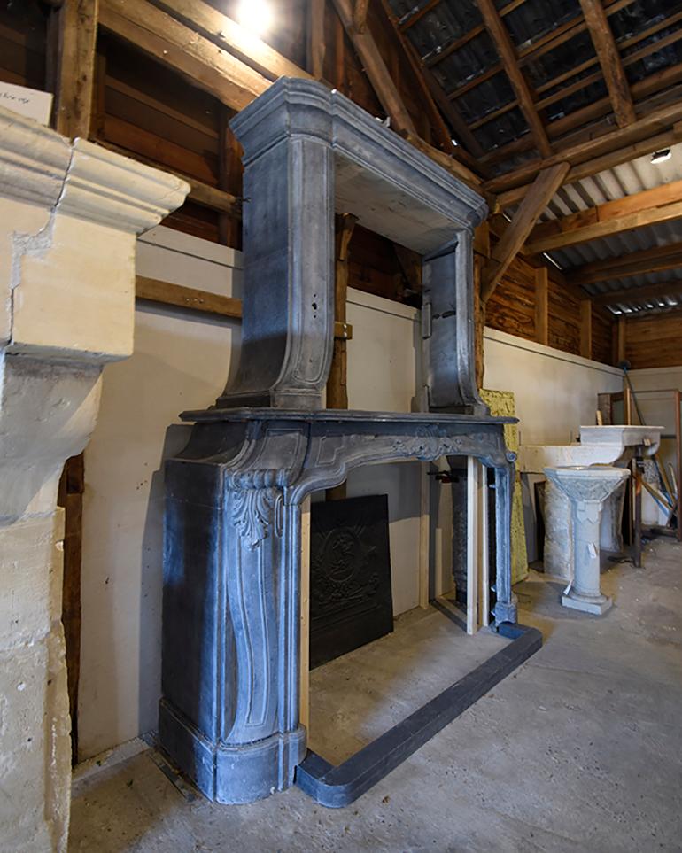 A very beautiful antique and unique fireplace mantel made out of Belgian bluestone
with a big open trumeau on top of it.
Recuperated out of a Castle in Belgium near Brussels.