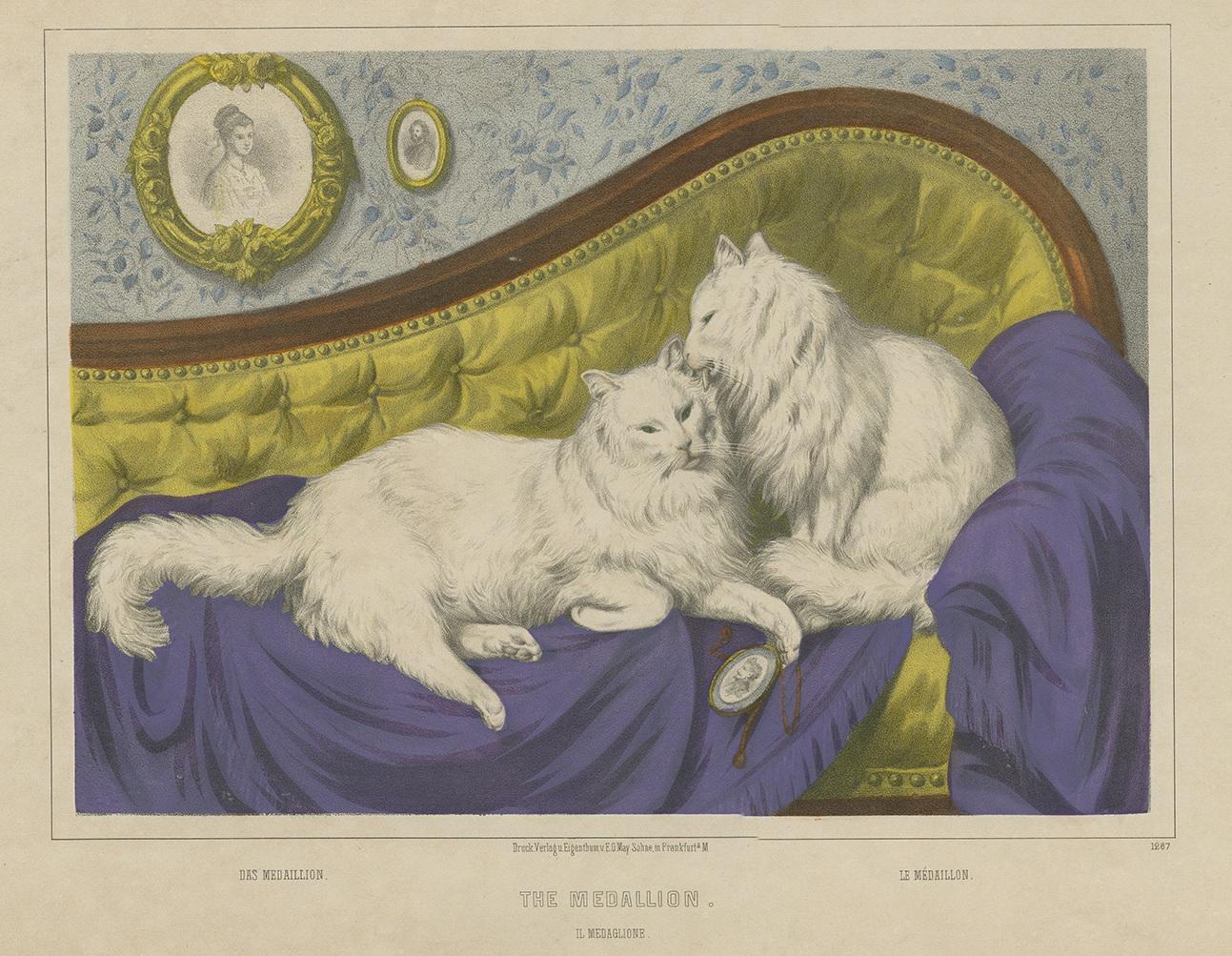 Antique print titled 'The Medaillon'. Antique lithograph depicting two white cats, one holding a medaillon. The subtitles read 'Das Medaillon/Le Médaillon/Il Medaglione'. Published by E.G. May Söhne, Frankfurt, circa 1850.