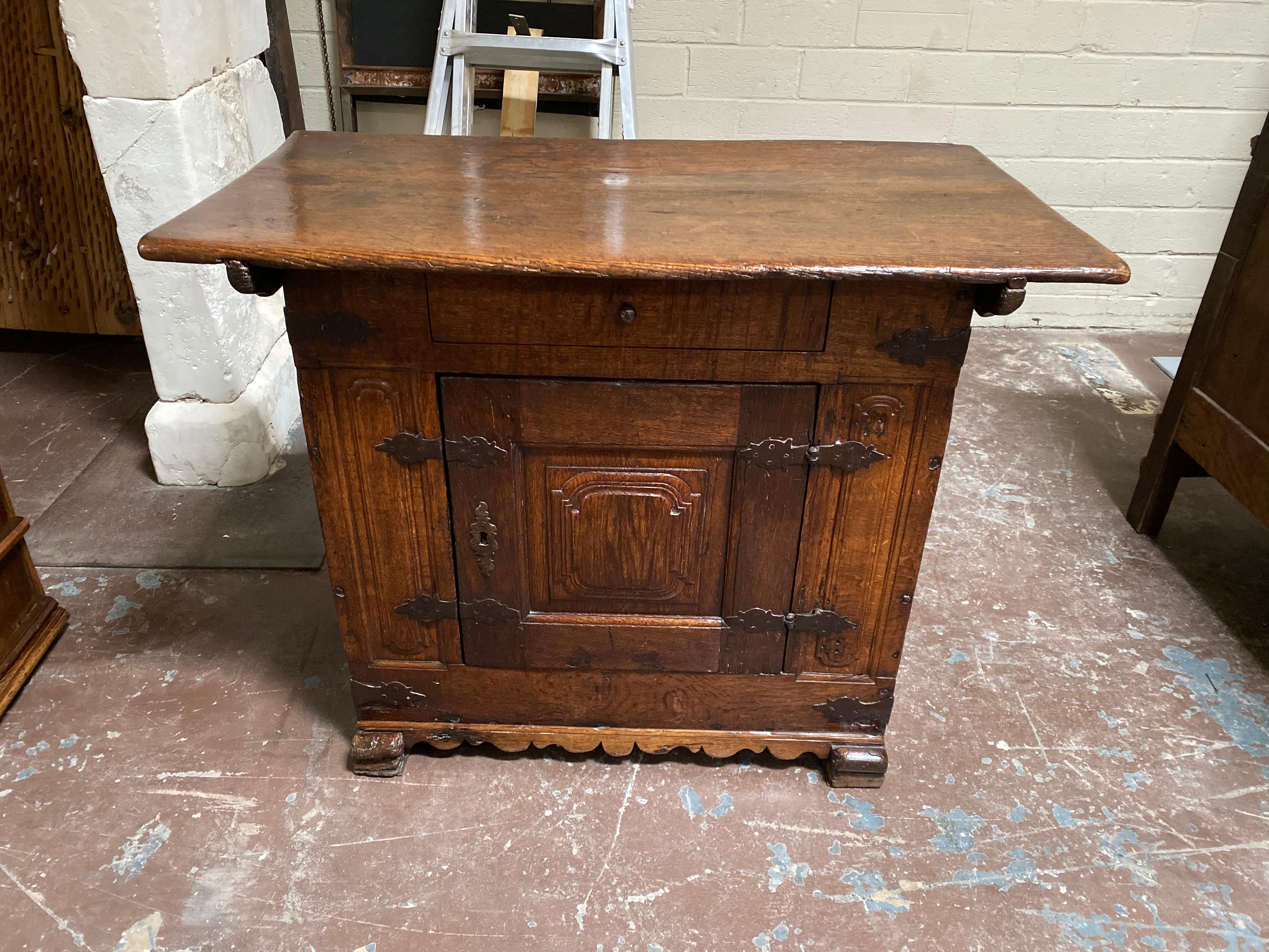 This antique Spanish console makes for a standout bedside table. 

Measurements: 23'' D x 43'' W x 33'' H.