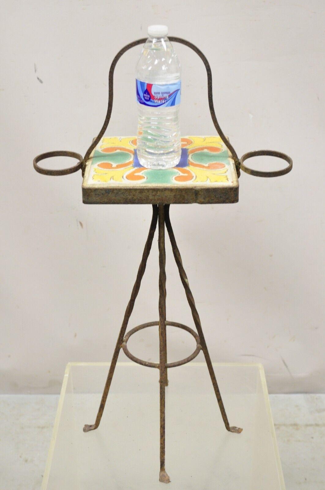 Antique Catalina California Arts & Crafts Tile Smoke Stand Small Side Table. Item features a wrought iron base, single square Arts & Crafts tile, wonderful yellow, blue, green, orange color, distressed finish, very nice antique item. Circa