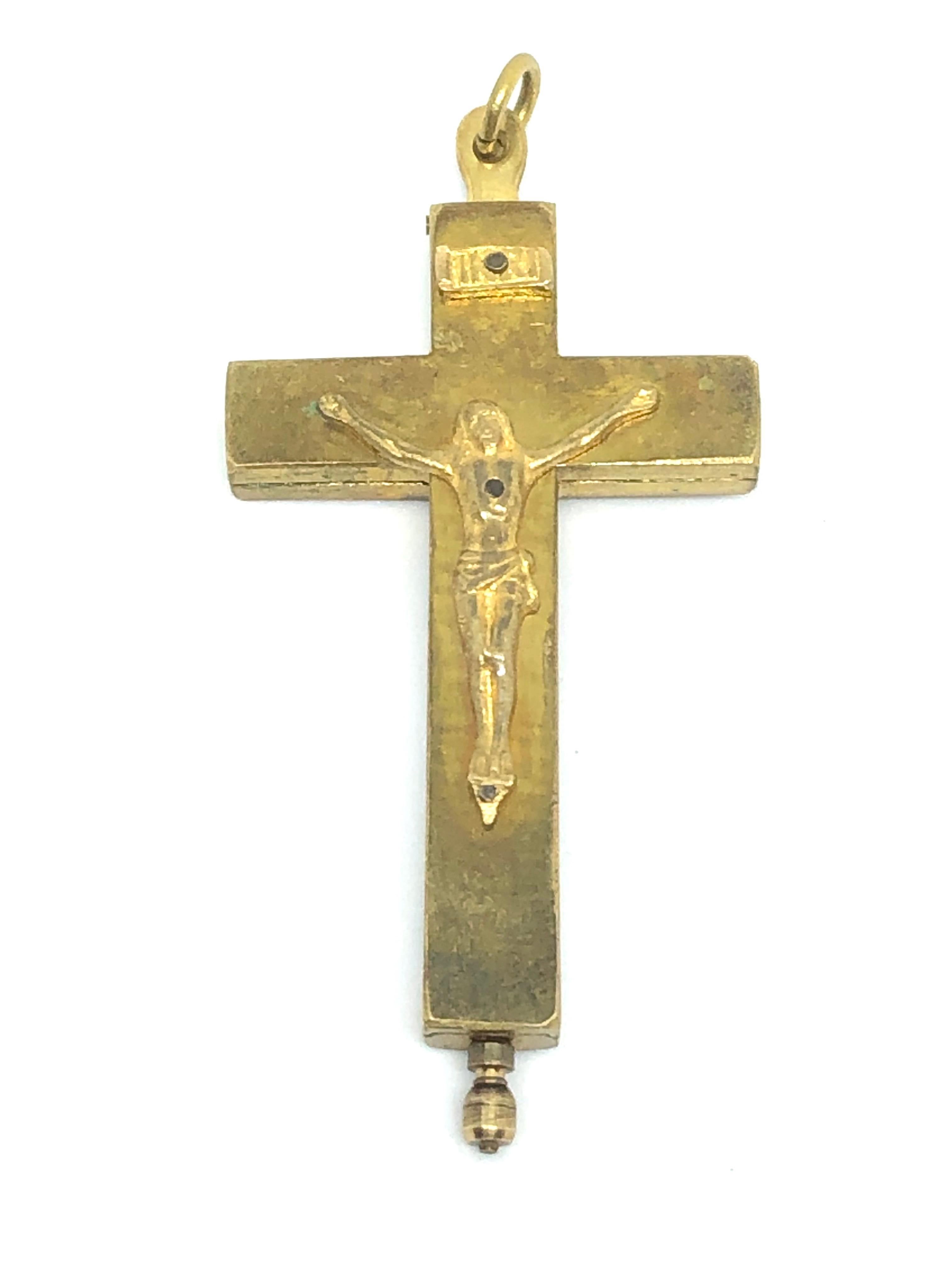 This antique reliquary contains 6 relics of Saints with gilded paper rolls and purple velvet. It is hand made of brass.
Its 3