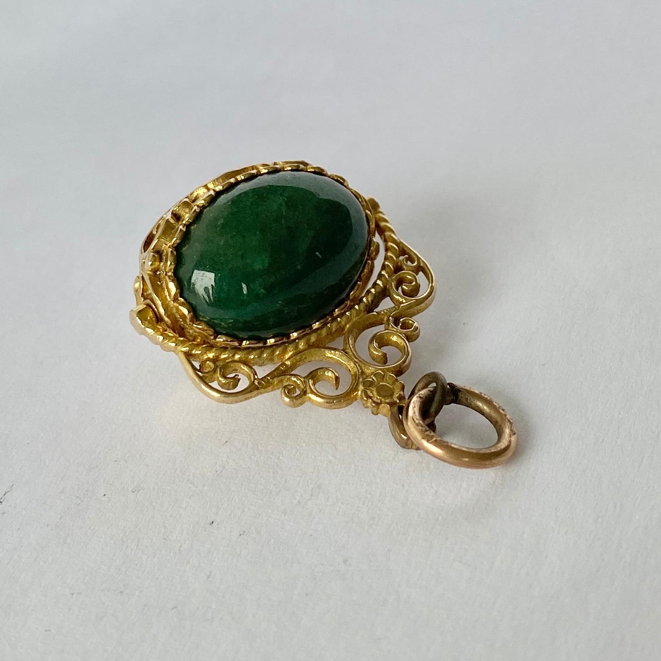 This sweet fob holds a cats eye and jadeite stone that are rounded and smooth. The stones spin and have a decorative frame modelled in 9ct gold. Fully hallmarked 1913 London. 

Fob height inc loop: 31mm

Weight: 10.7g