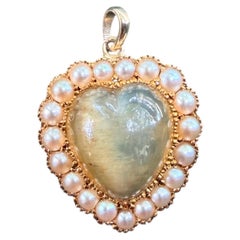 Antique cats eye and pearl necklace pendant in 14kt yellow gold circa early 1900