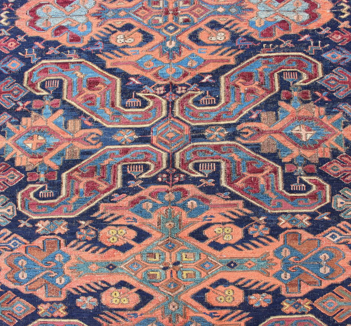 Wool Antique Caucasian 19th Century Sumac Rug in Varying Colors of Orange and Blue For Sale