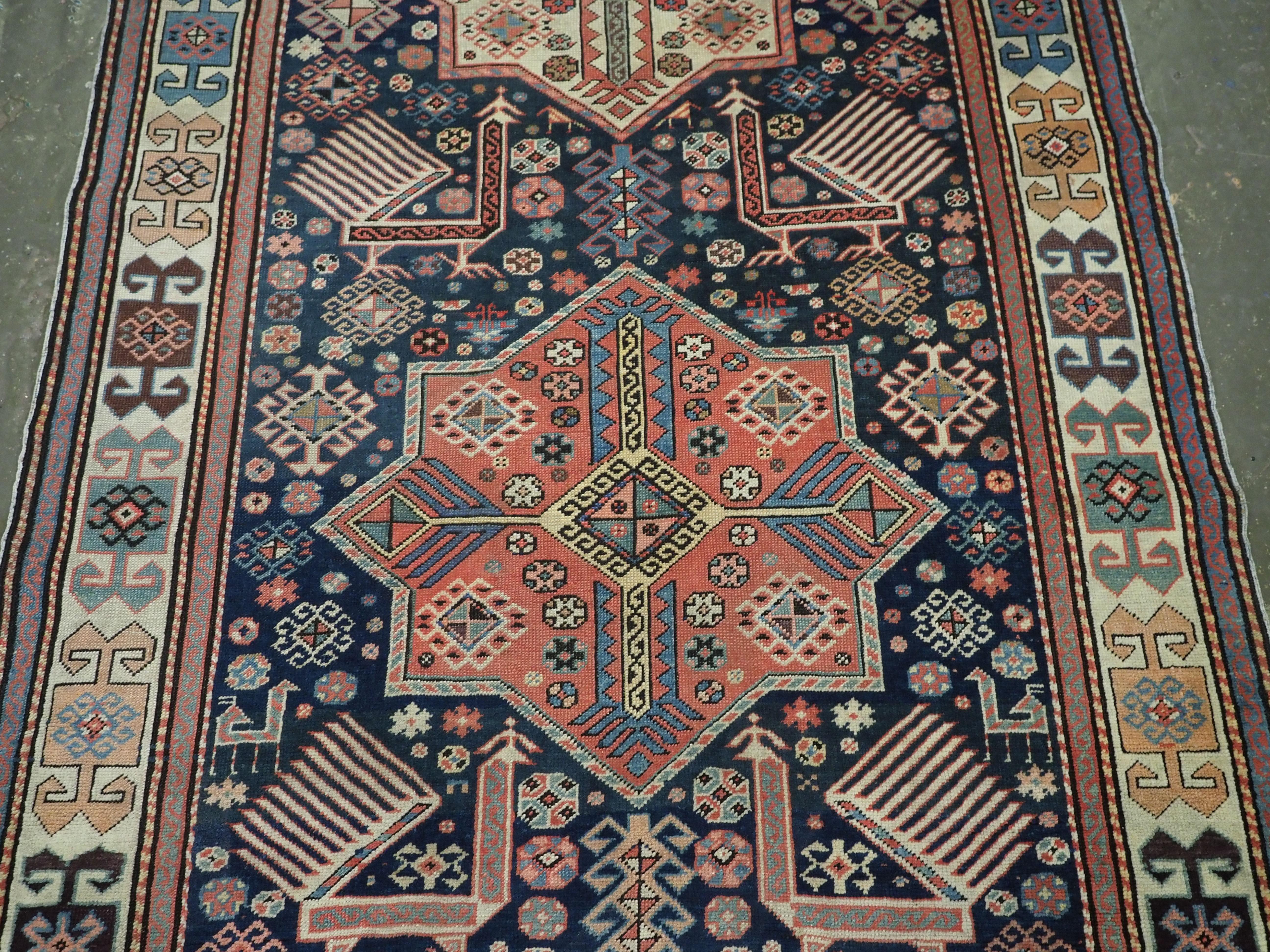 Antique Caucasian Akstafa long rug with three star medallions, circa 1880. In Good Condition For Sale In Moreton-In-Marsh, GB