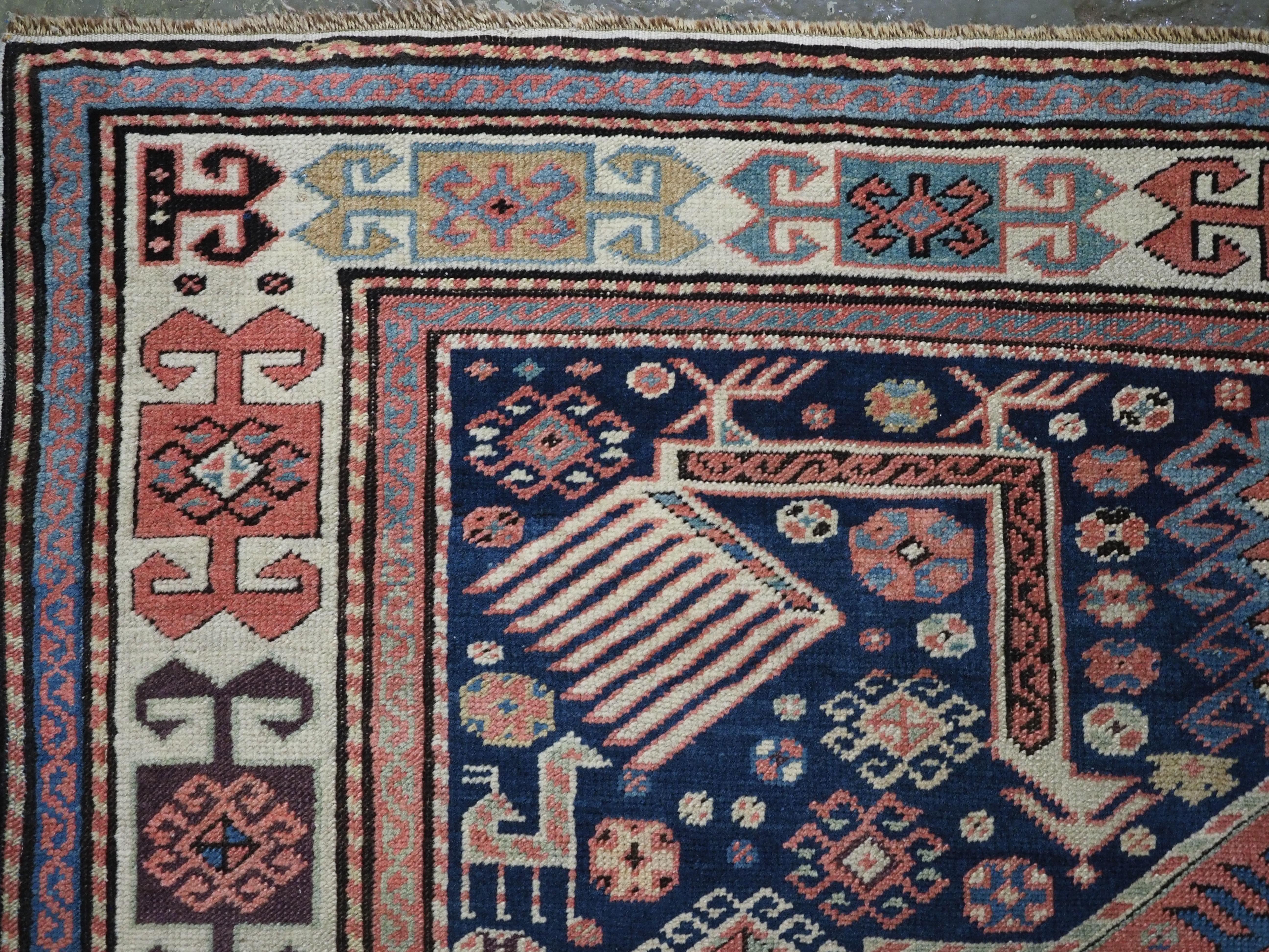 Wool Antique Caucasian Akstafa long rug with three star medallions, circa 1880. For Sale