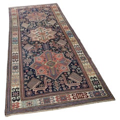 Antique Caucasian Akstafa long rug with three star medallions, circa 1880.