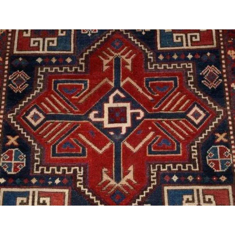 An antique Caucasian Akstafa runner from the 4th quarter of the 19th century. Beautifully drawn with 5, eight pointed star medallions. Good filler elements and animals in each corner and an excellent ivory ground border.

Superb condition with