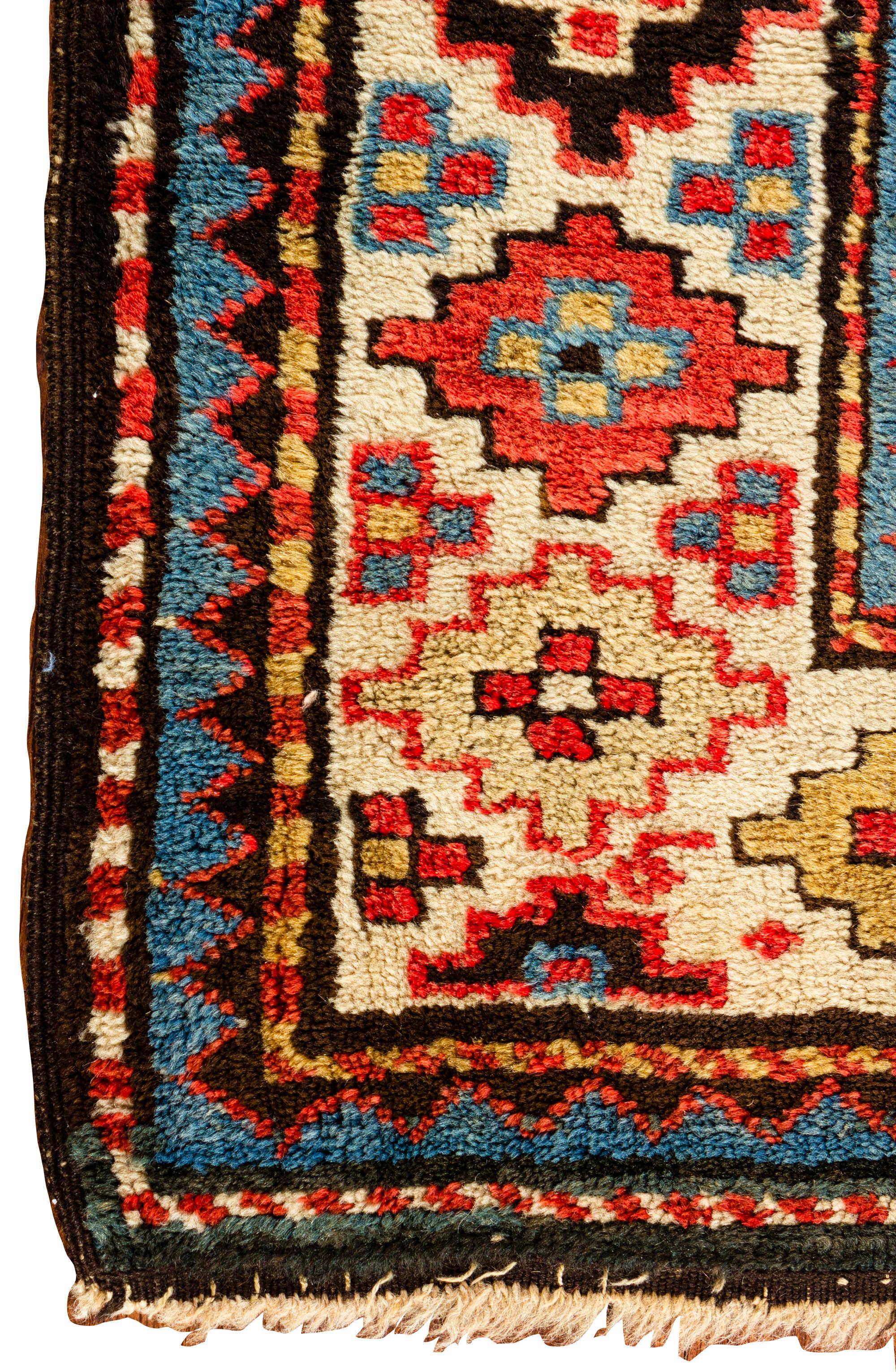 Antique Caucasian Alpan Kuba rug, circa 1890. From eastern Caucasia a handwoven antique Alpan Kuba rug, circa 1890. The wonderful tribal designs in the centre comprising of three distinct areas in shades of green, rust and blue split by four
