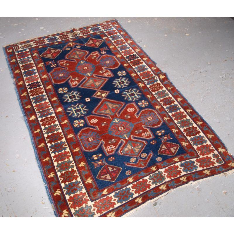 Antique Armenian Erivan rug with two design on a indigo blue ground.

A good small Erivan rug with a medallion design on a indigo field. The medallion have a lobbed or snowflake shape, the field is filled with traditional design elements.

The