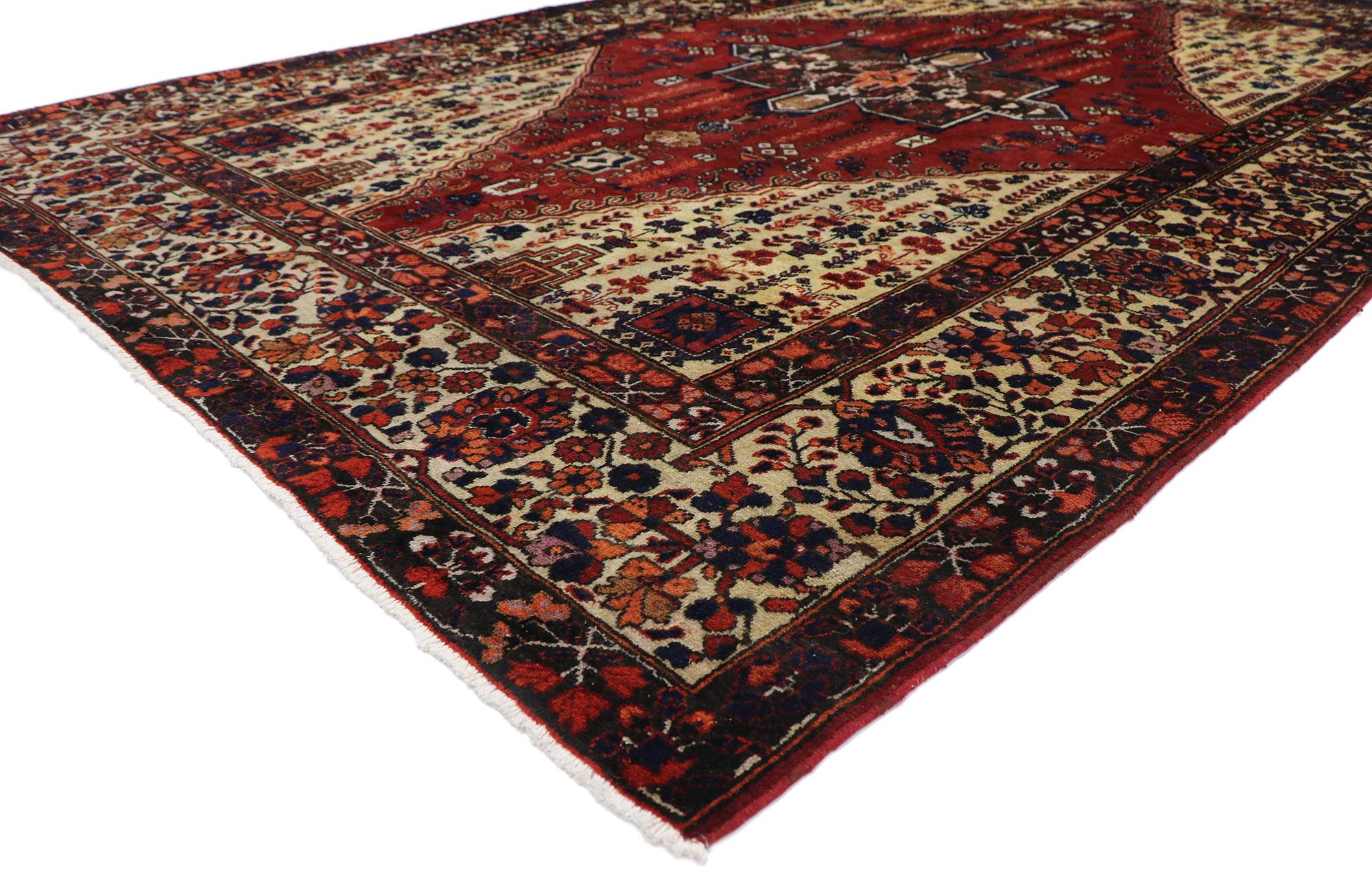 60928 Antique Caucasian Azerbaijan rug 07'00 x 10'00. Warm and inviting, this hand-knotted wool antique Caucasian Azerbaijan rug emanates nomadic charm with a hint of sophistication. The abrashed field features a large scale brick red lozenge
