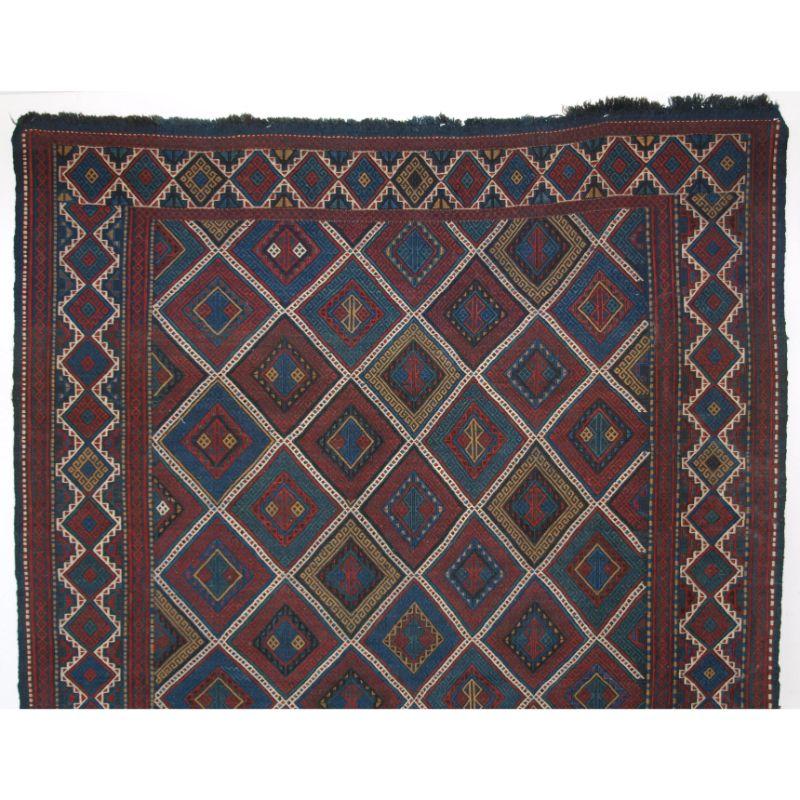 Antique Caucasian Azeri Verneh of diamond lattice design.

Verneh are embroidered flat weaves unique to the Azeri of the Caucasus. This example is of the diamond lattice design, with fine detail and superb colours.

The Verneh is in perfect