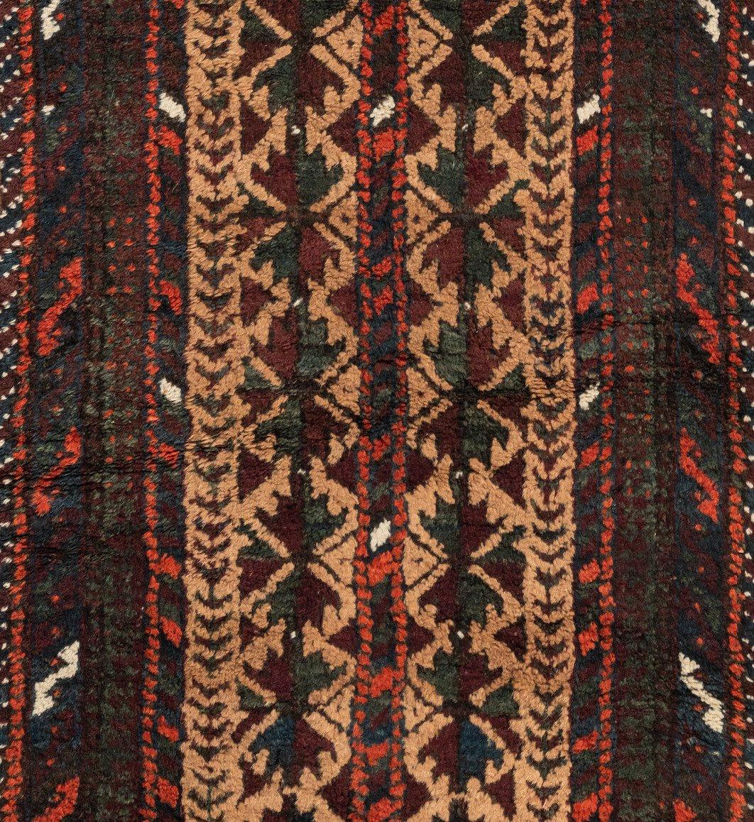 Baluch carpets are handmade carpets originally made by Baluch nomads, living near the border between Iran, Pakistan and Afghanistan. The carpets are often small with lively patterns, and praying carpets are common. The dominating colors are red,
