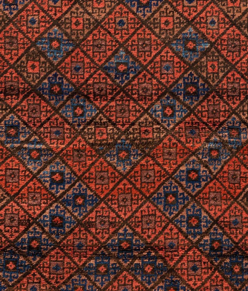 Baluch carpets are handmade carpets originally made by Baluch nomads, living near the border between Iran, Pakistan and Afghanistan. The carpets are often small with lively patterns, and praying carpets are common. The dominating colors are red,