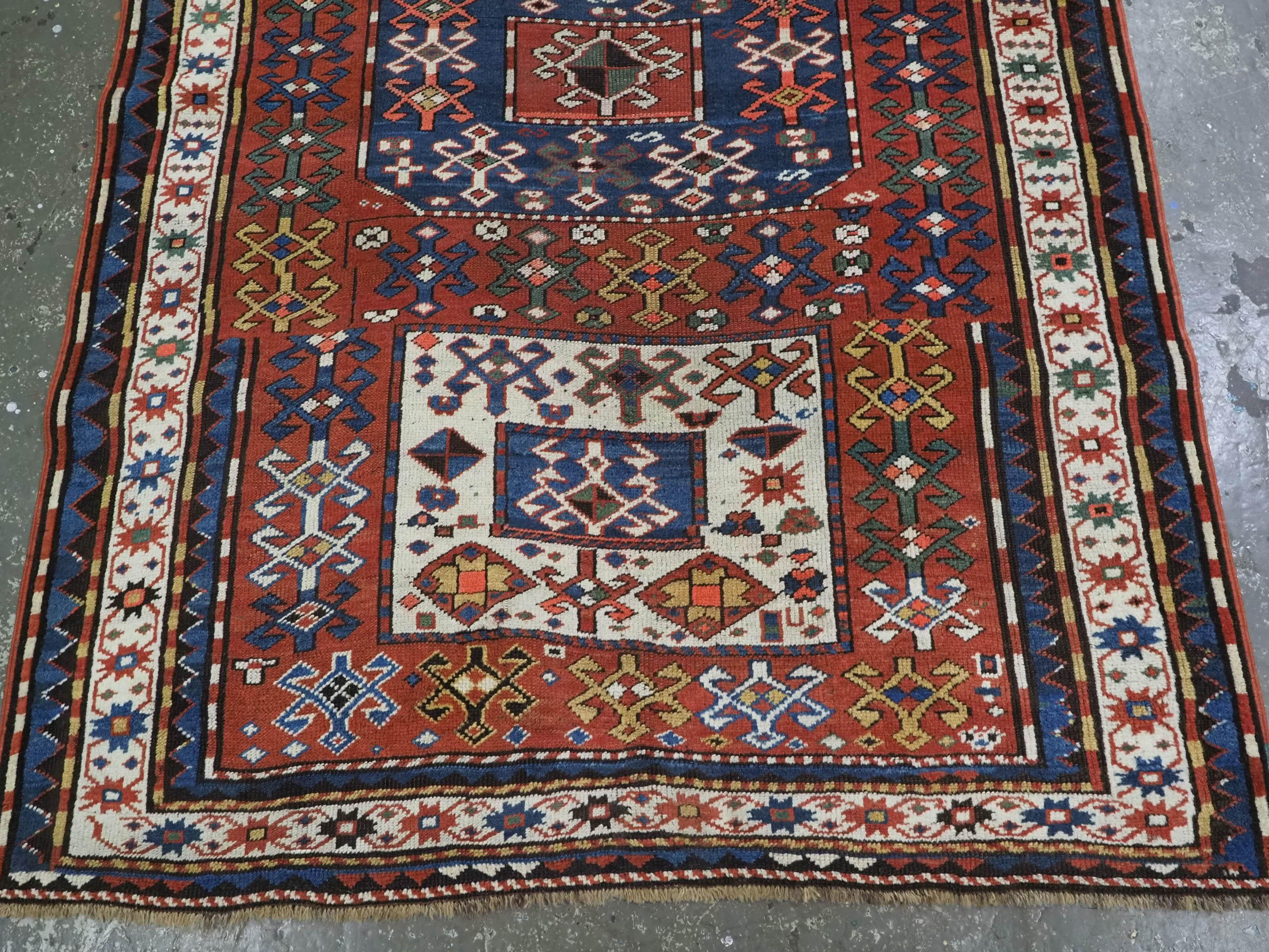 Wool Antique Caucasian Chajli long rug with triple medallion design.  Circa 1880. For Sale