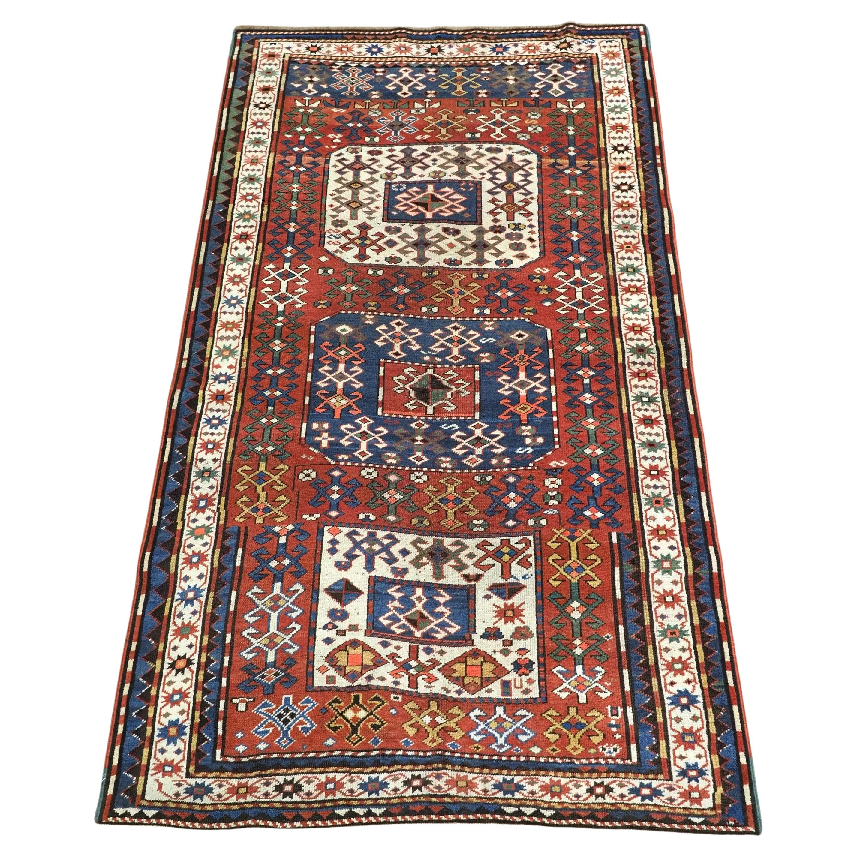 Antique Caucasian Chajli long rug with triple medallion design.  Circa 1880. For Sale