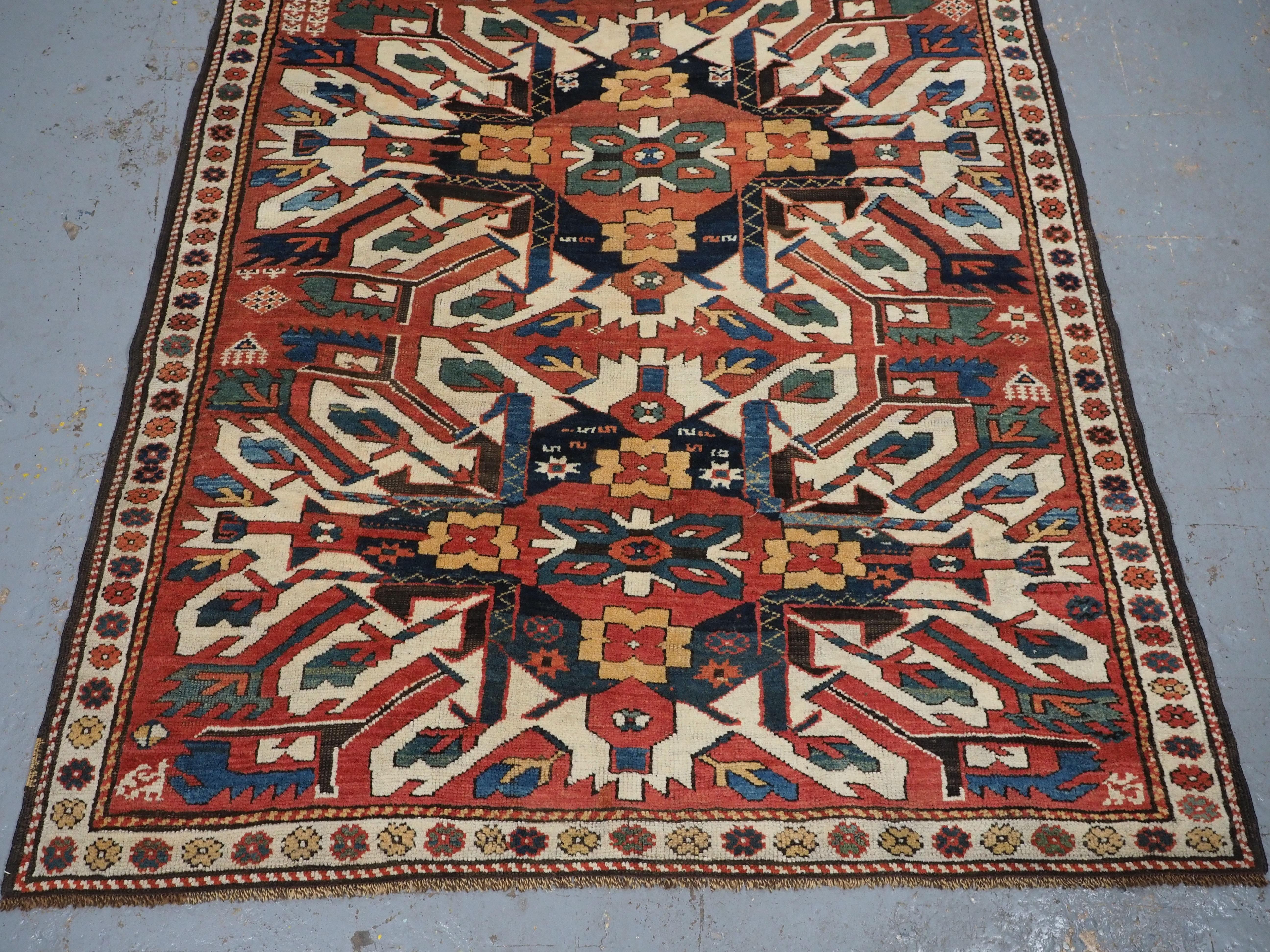 Wool Antique Caucasian Chelaberd Kazak triple medallion rug, circa 1890. For Sale