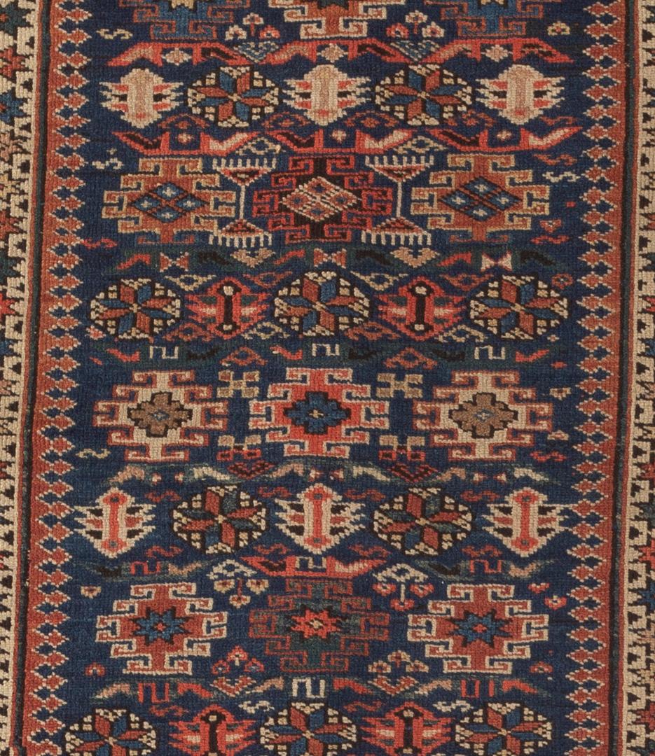 Antique Caucasian Chichi rug, circa 1880. Chichi rugs are among the more finely knotted Caucasian rugs, and come from villages around Kuba in Azerbaijan. This fine example has a navy ground filled with floral elements surrounded by multiple borders.