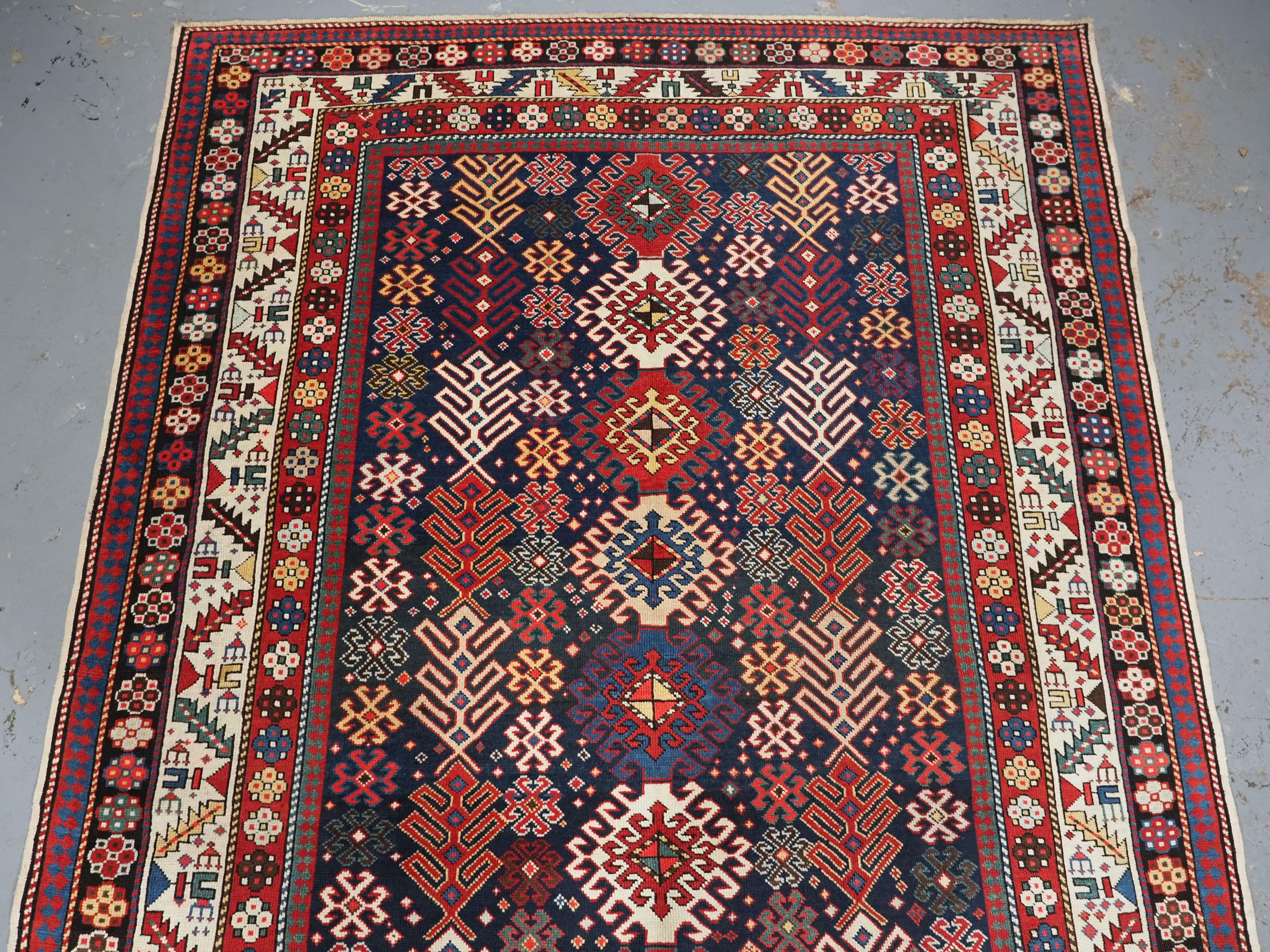 Asian Antique Caucasian Dagestan long rug with hooked medallion design.  Circa 1890. For Sale