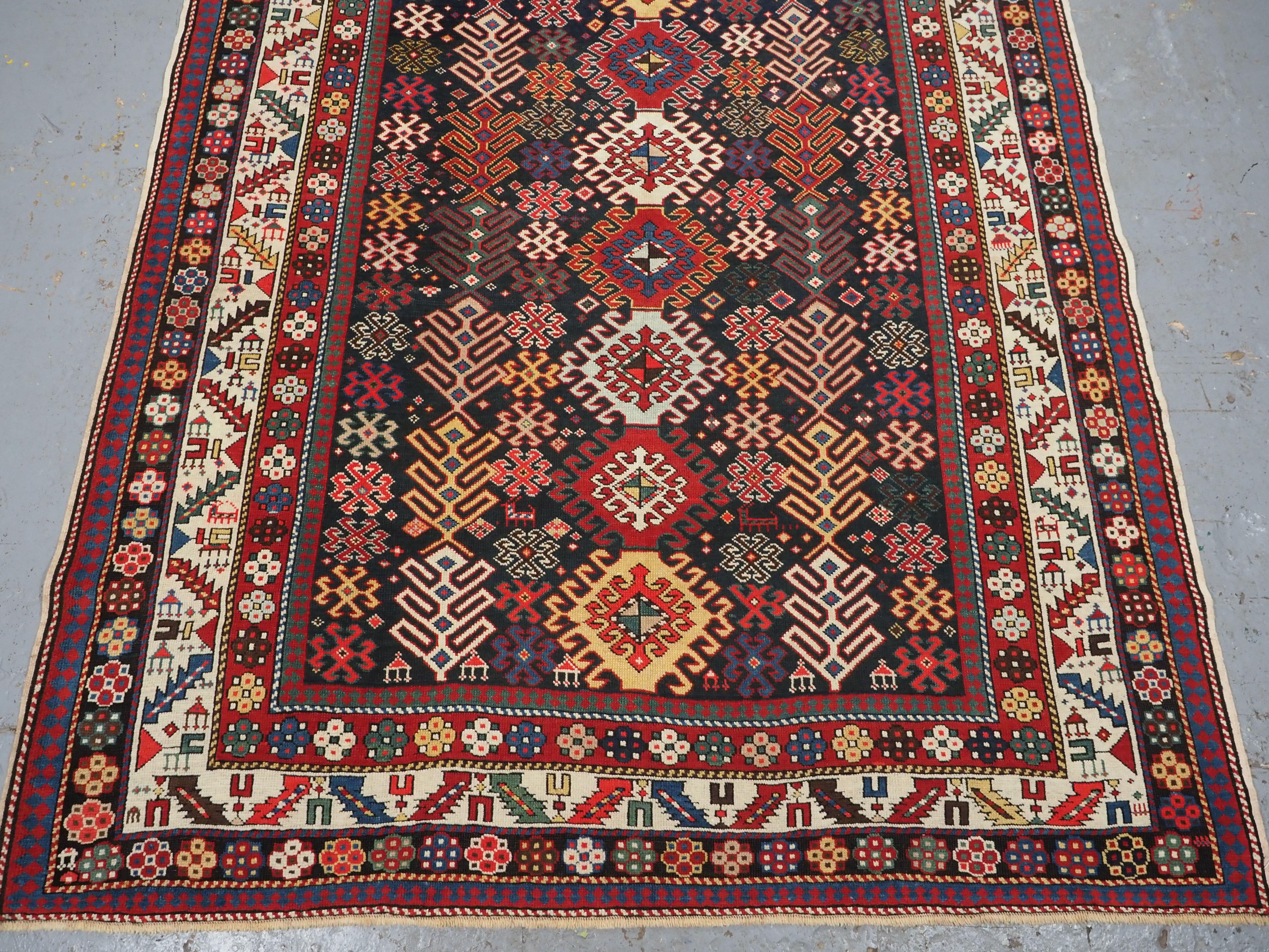Late 19th Century Antique Caucasian Dagestan long rug with hooked medallion design.  Circa 1890. For Sale