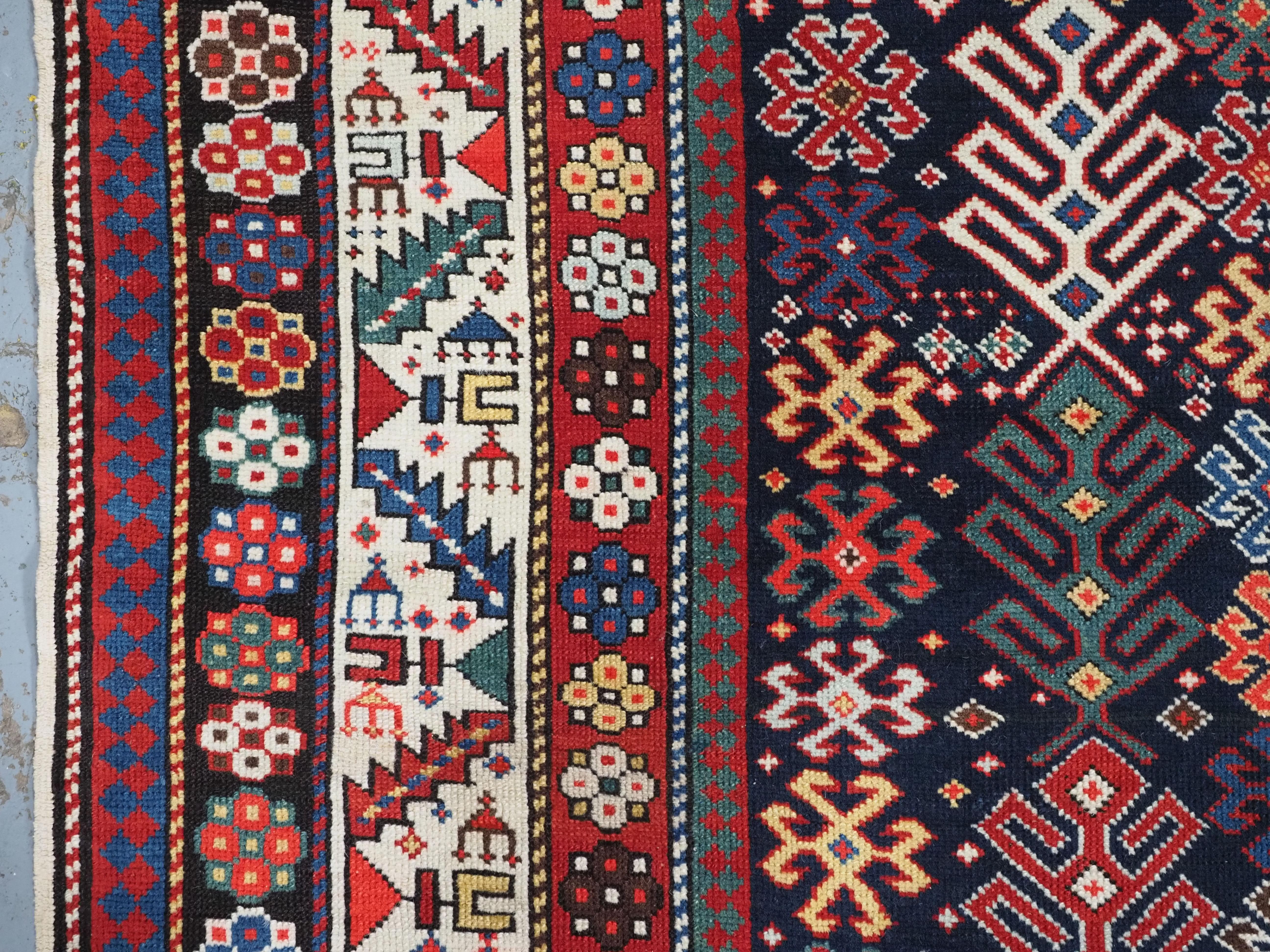 Antique Caucasian Dagestan long rug with hooked medallion design.  Circa 1890. For Sale 1