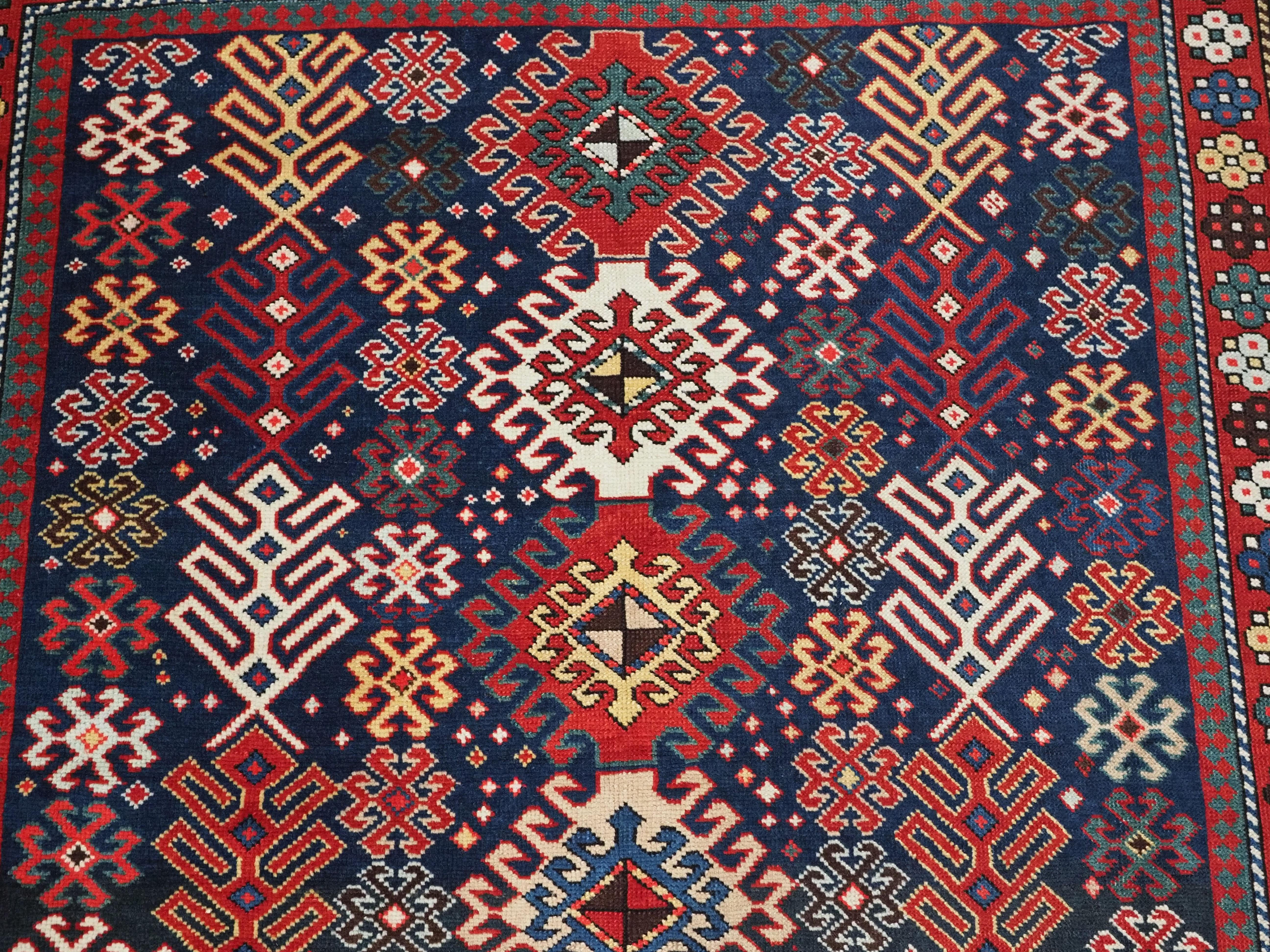 Antique Caucasian Dagestan long rug with hooked medallion design.  Circa 1890. For Sale 2