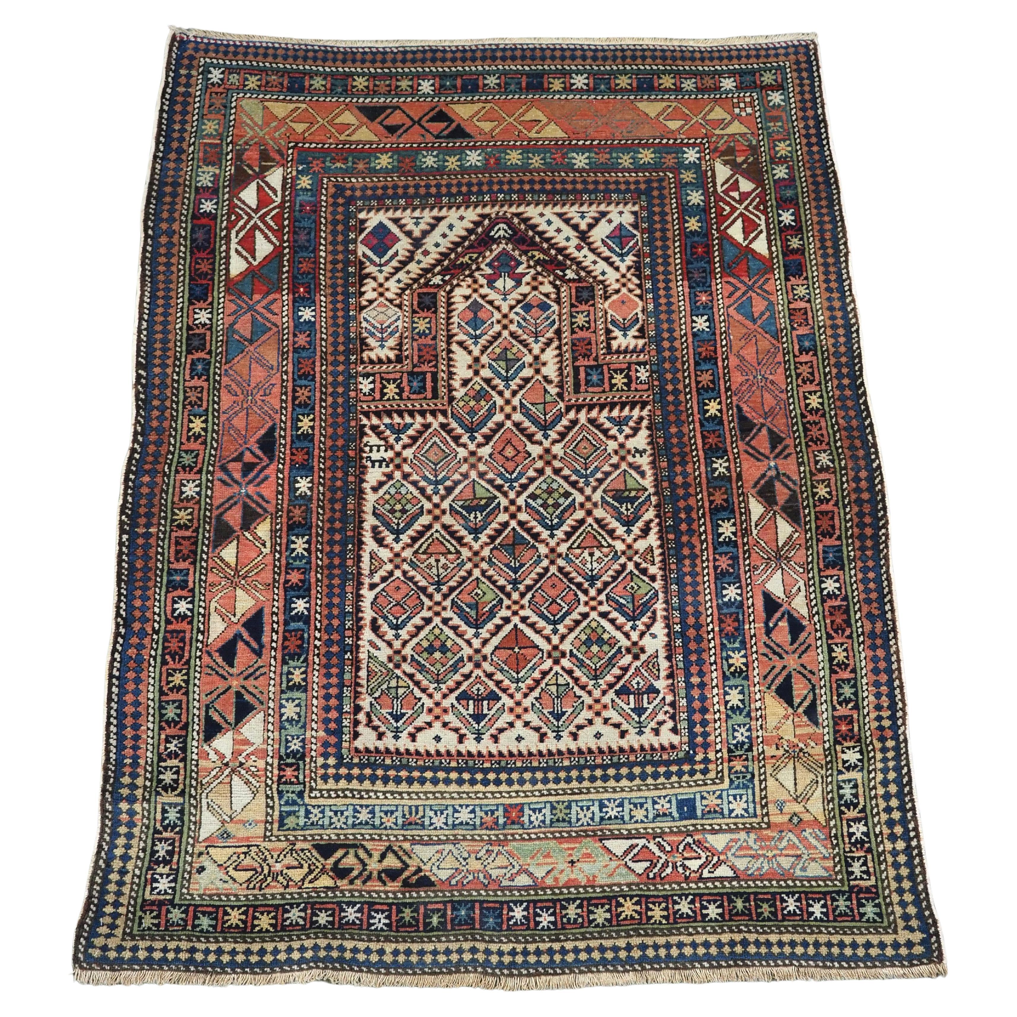 Antique Caucasian Dagestan prayer rug with floral lattice on ivory ground, 1880. For Sale