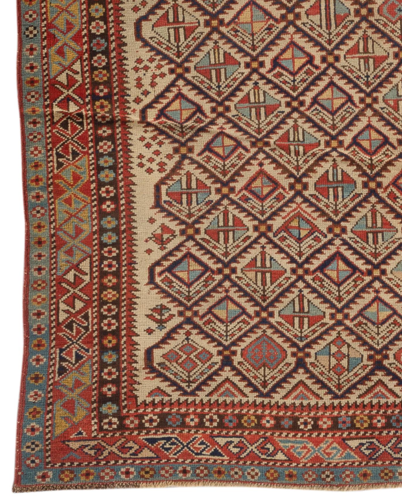 Antique Caucasian Dagestan rug, circa 1880. A mihrab design on an ivory field filled with wonderful ethnic designs and surrounded by the traditional Caucasian multiple borders. Dagestan is located inside Russia in the north of Caucasia, up until the