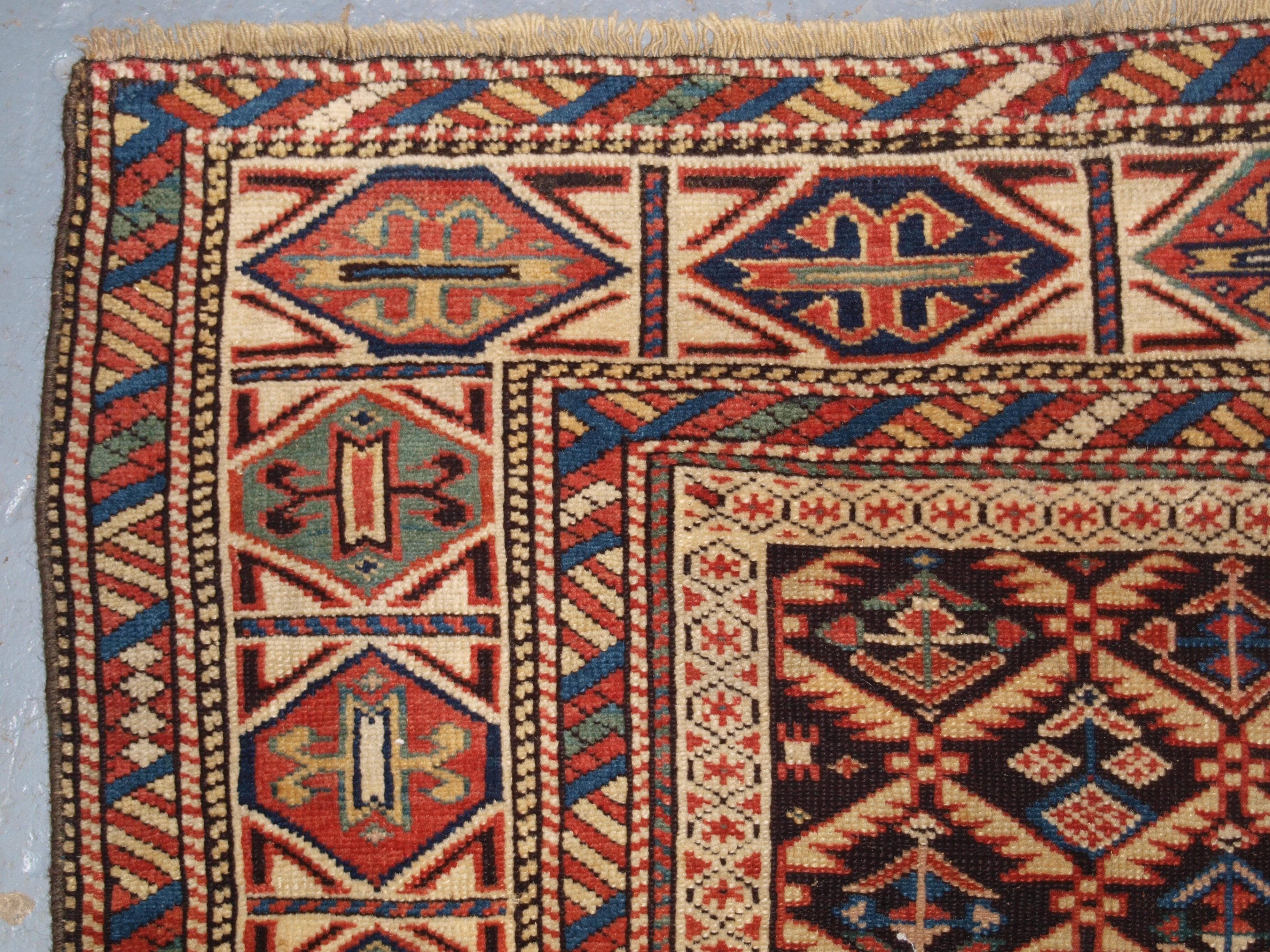 Wool Antique Caucasian Dagestan Rug with Lattice Design on Dark Charcoal Ground