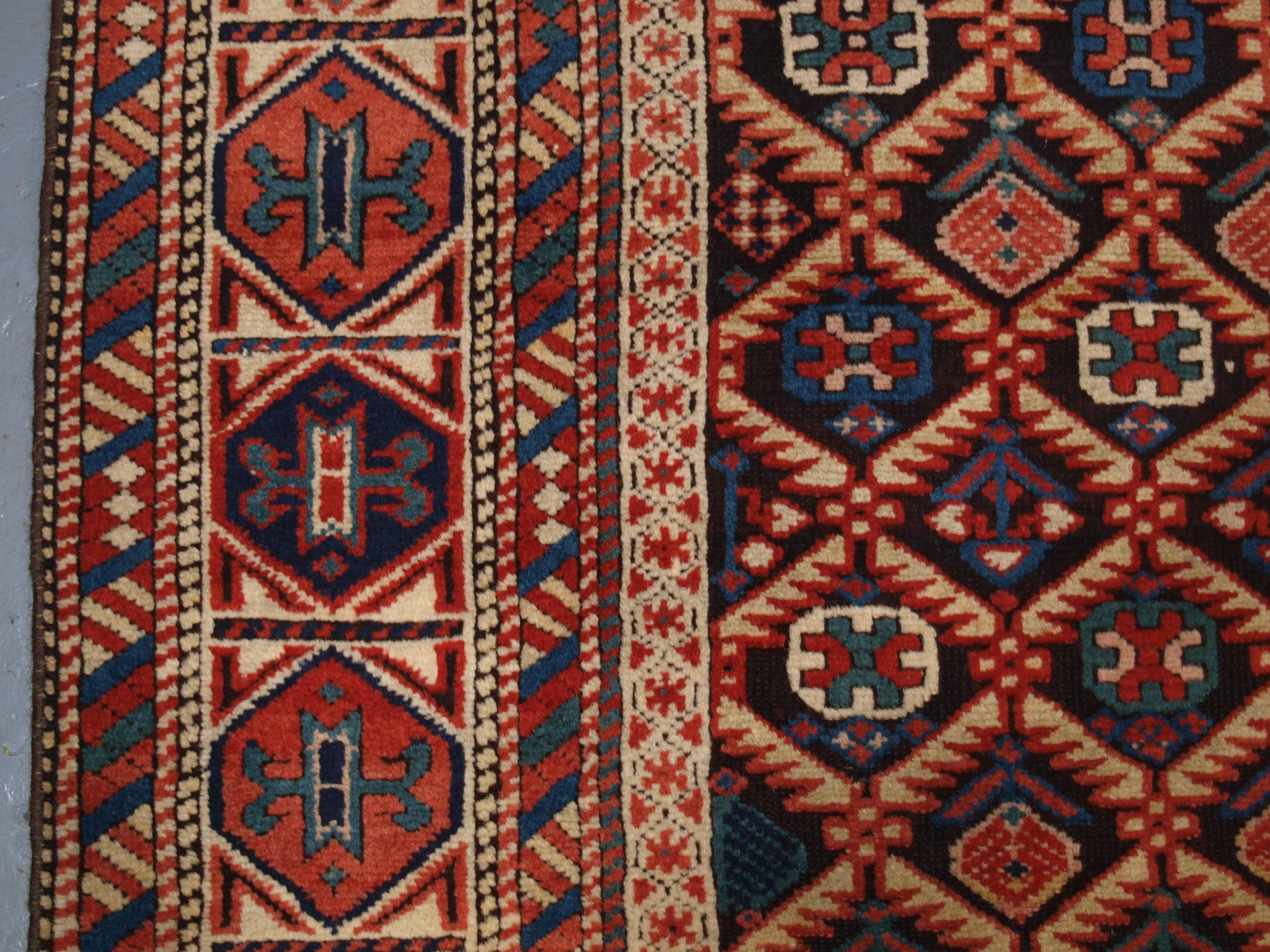 Antique Caucasian Dagestan Rug with Lattice Design on Dark Charcoal Ground 1