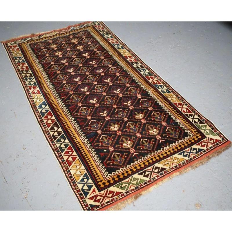 A superb example of this well known group of rugs, this rug has excellent colour and is very well drawn with a lattice and shrub design.

The rug has a classic Caucasian main border and the use of yellow and green give a very light feel that