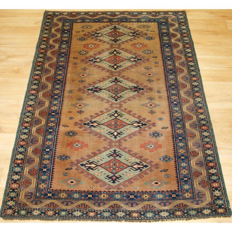 Antique Caucasian Derbent rug of very fine weave and a soft colour palette.

The town of Derbent is located on the coast of the Caspian sea in the North East Caucasus and has a long weaving tradition. This small rug is a pleasing example with fine