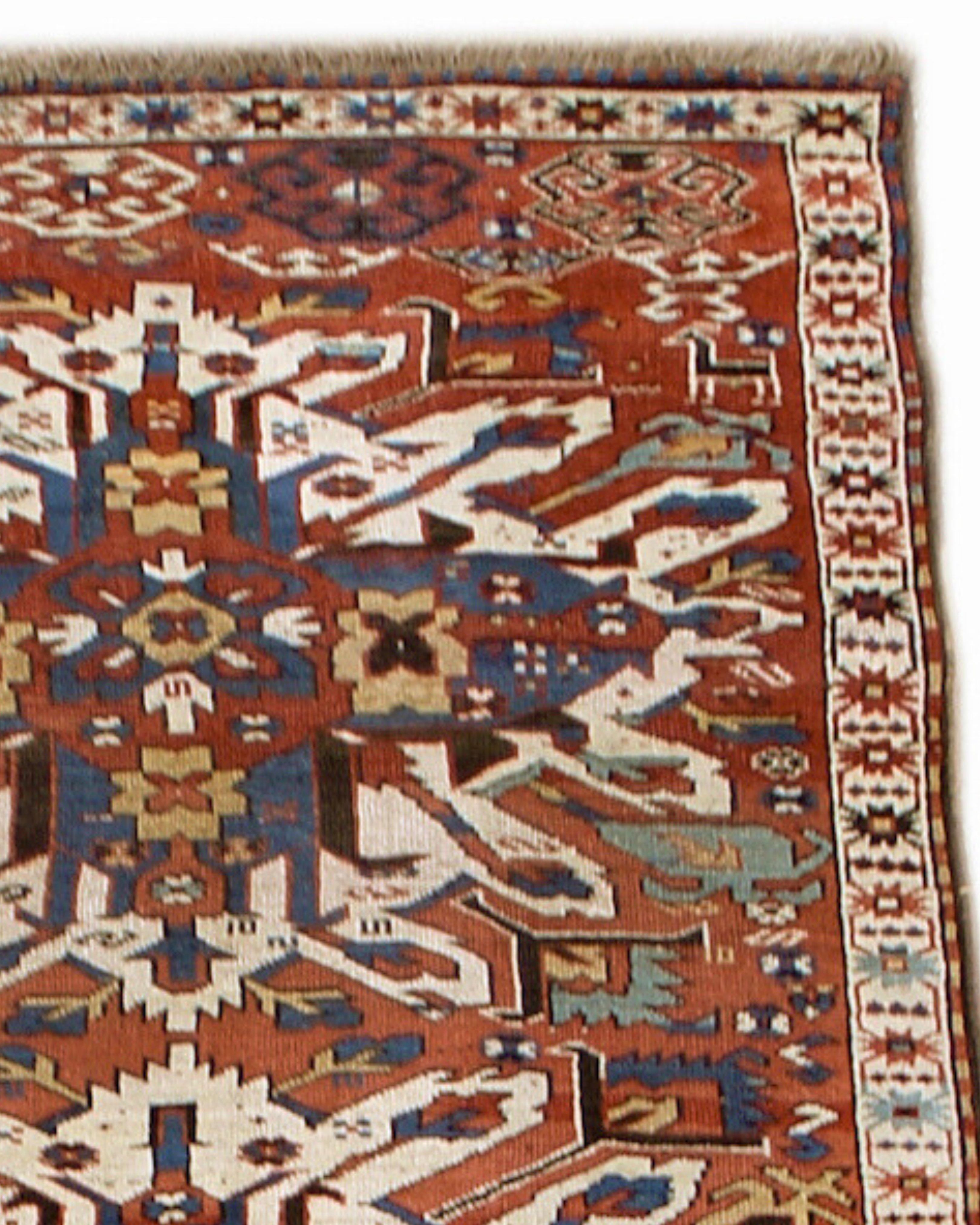 Antique Caucasian Eagle Karabagh Rug, 19th Century

A column of three ‘eagle medallions’, named for their evocation of the plumage of stretched eagle wings, are traced against the brick madder red ground in this classic Karabagh rug. Small iconic