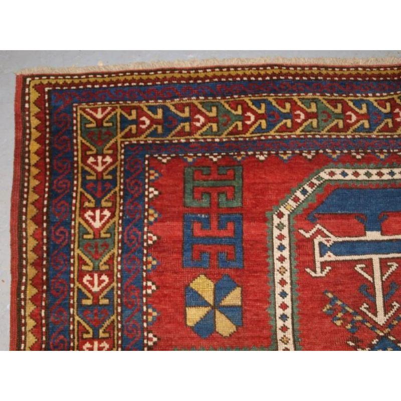 A well drawn rug with excellent clear primary colours with a large ivory ground central medallion with a floating mihrab at the top of the rug. This rug is slightly larger than others of this design that I have seen.

The rug is in good condition