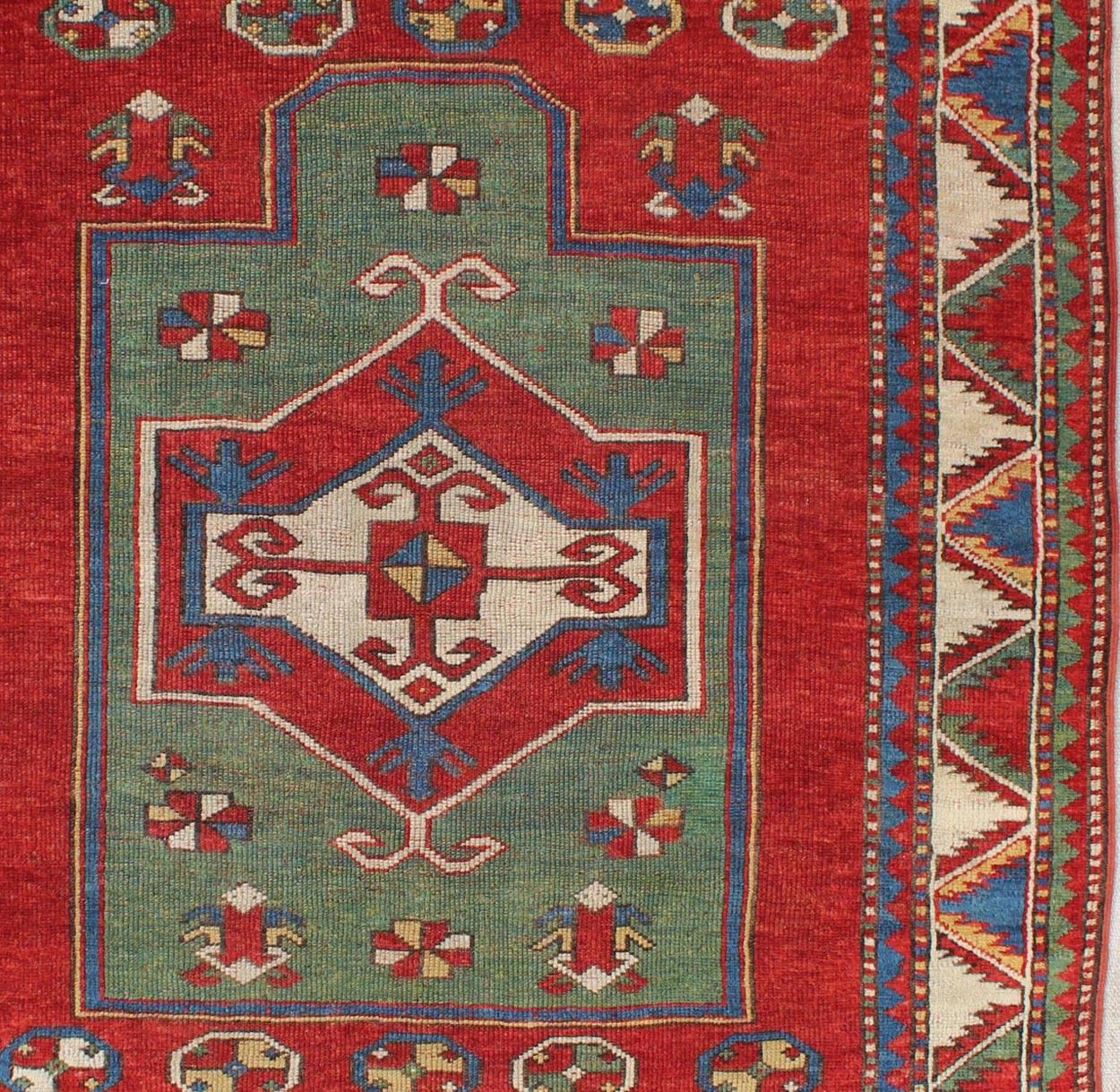 Hand-Knotted Antique Caucasian Fachralo Kazak with Tribal Design in Green, Red and Ivory For Sale