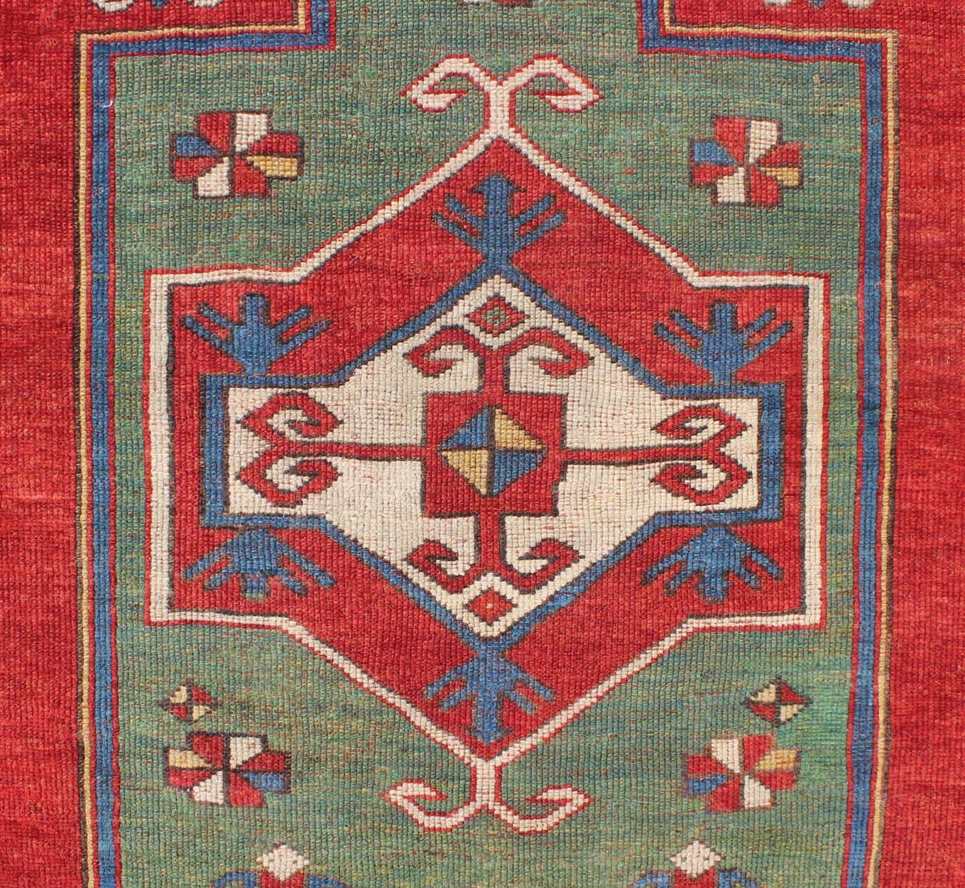 Late 19th Century Antique Caucasian Fachralo Kazak with Tribal Design in Green, Red and Ivory For Sale