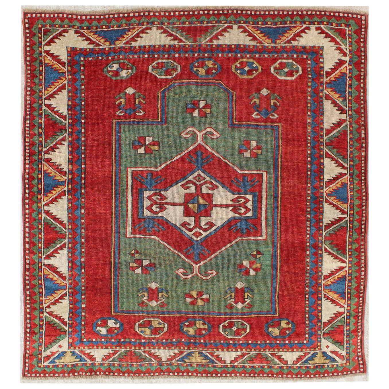 Antique Caucasian Fachralo Kazak with Tribal Design in Green, Red and Ivory For Sale