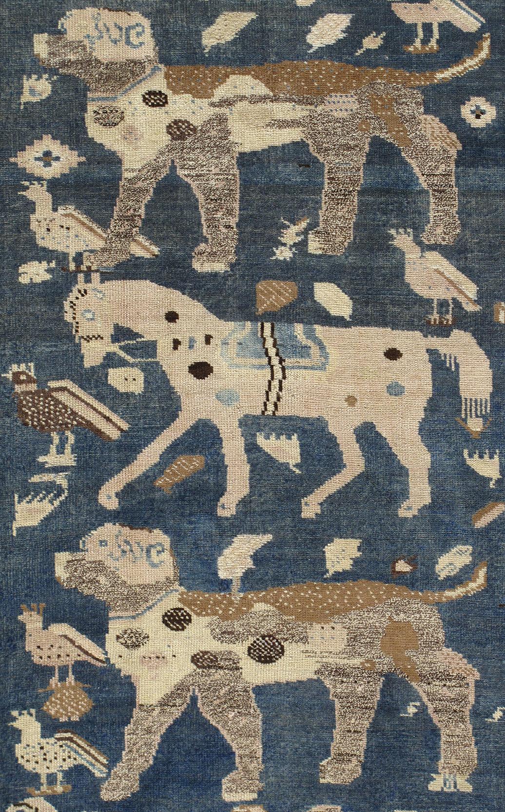 This antique Caucasian tribal rug is from Azerbaijan, a country located in the south Caucasus region. It is constructed of 100% handspun wool and natural dyes. This is a Garabagh design that features horses and dogs. European influence is also found