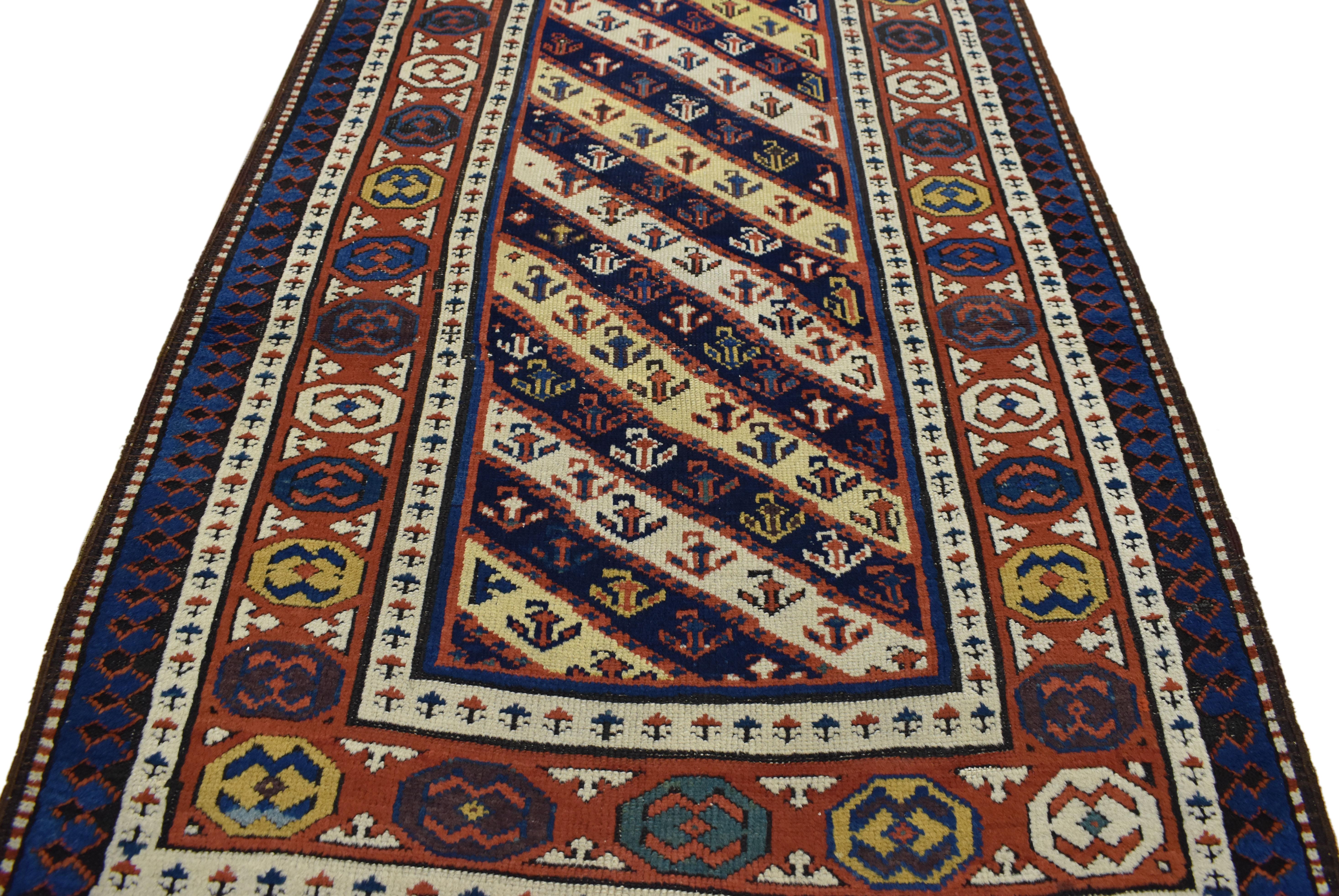 73235, antique Caucasian Kuba runner with tribal style, hallway runner. The antique Caucasian Gendje tribal runner communicates some of the finer and more important points of geometric design elements from the villages of Gendje. Classically