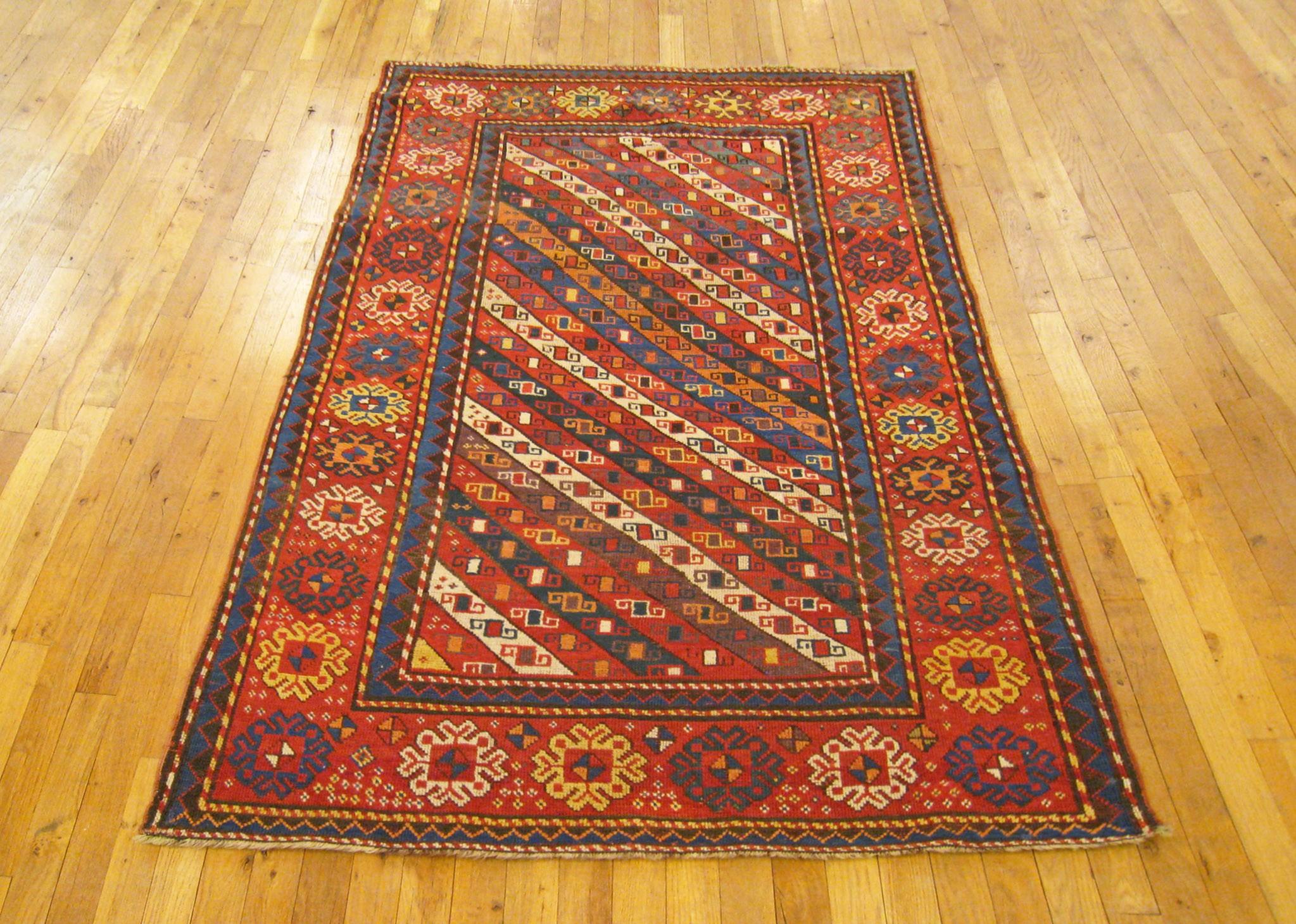 Antique Caucasian Gendje rug, runner size, circa 1890.

A one-of-a-kind antique Caucasian Gendje oriental rug, hand-knotted with soft and supple wool pile. This lovely hand-knotted carpet features a serie of diagonal stripes in the primary field,