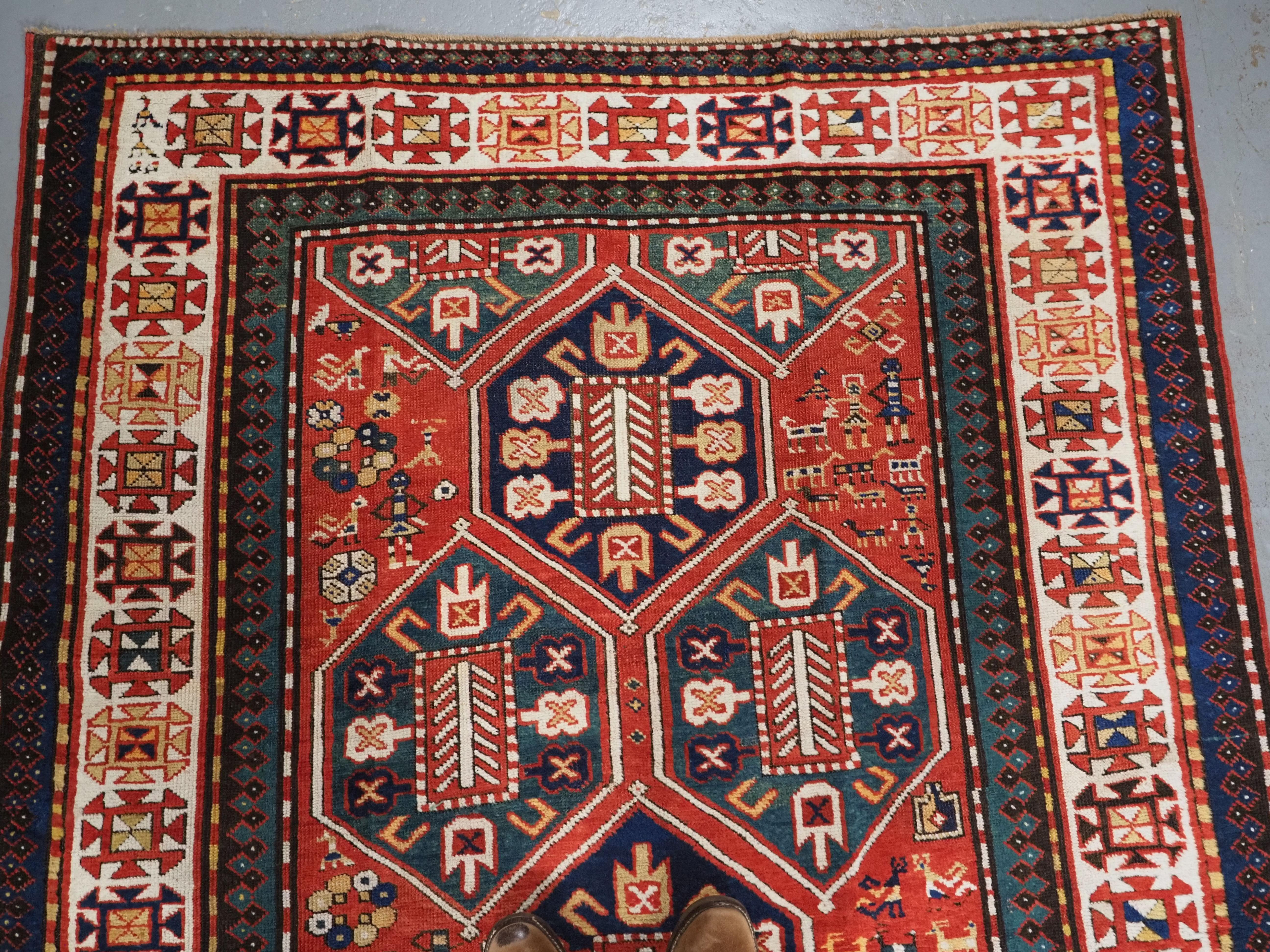 Asian Antique Caucasian Gendje rug with wonderful folk art design.  Circa 1890. For Sale